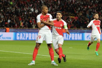 MONACO, MONACO - APRIL 19:  Kylian Mbappe of AS Monaco celebrates his goal with captain Radamel Falcao during the UEFA Champions League Quarter Final second leg between AS Monaco and Borussia Dortmund at Stade Louis II on April 19, 2017 in Monaco, Monaco.