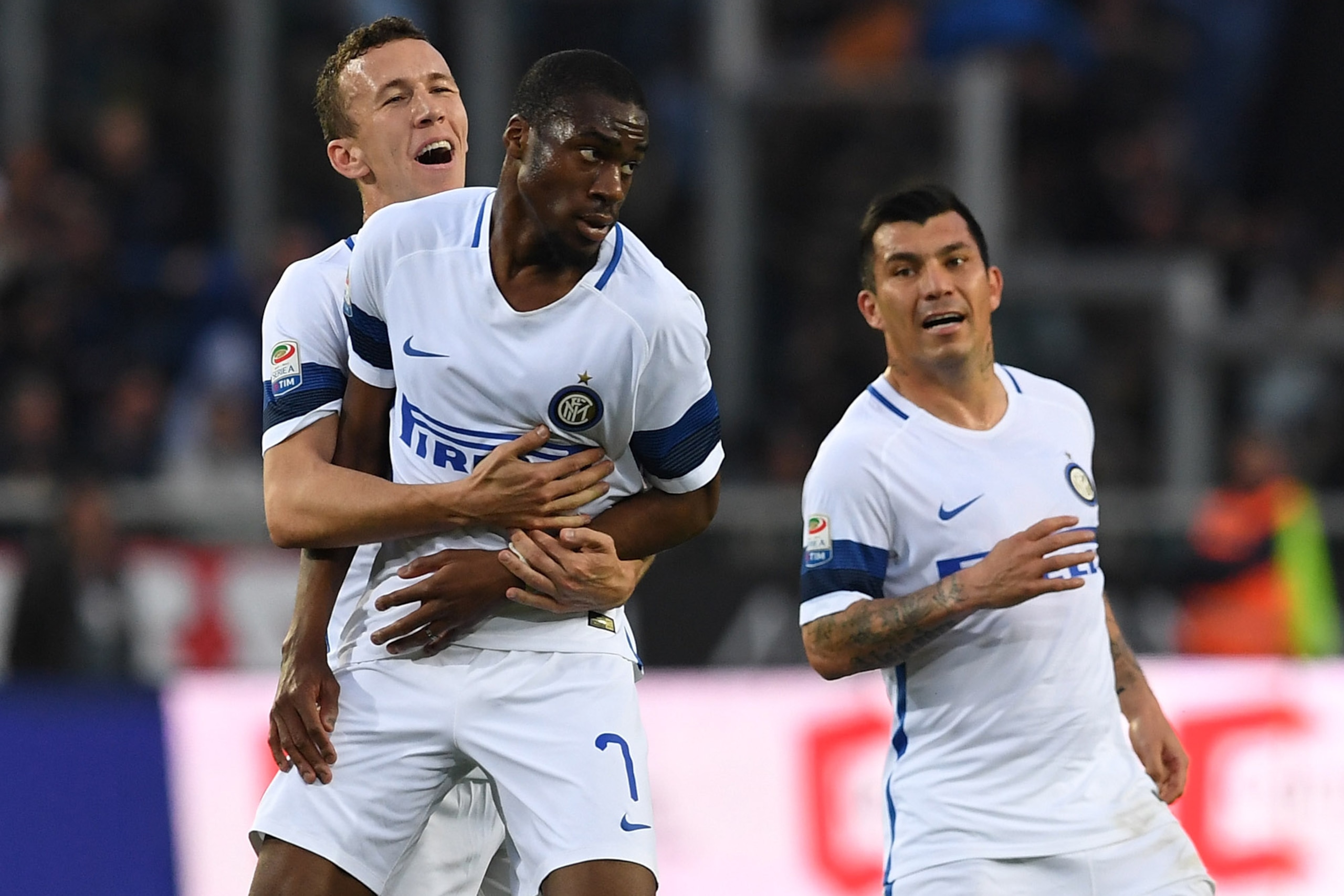 TURIN, ITALY - MARCH 18: Geoffrey Kondogbia (C) of FC Internazionale celebrates after scoring the opening goal with team mate Ivan Perisic (L) during the Serie A match between FC Torino and FC Internazionale at Stadio Olimpico di Torino on March 18, 201 TURIN, ITALY - MARCH 18: Geoffrey Kondogbia (C) of FC Internazionale celebrates after scoring the opening goal with team mate Ivan Perisic (L) during the Serie A match between FC Torino and FC Internazionale at Stadio Olimpico di Torino on March 18, 201