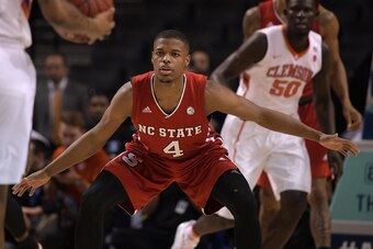 NEW YORK, NY - MARCH 07: Dennis Smith Jr. #4 of the North Carolina State Wolfpack defends during their game against the Clemson Tigers during the first round of the ACC Basketball Tournament at Barclays Center on March 7, 2017 in the Brooklyn borough of N