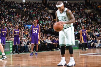 BOSTON, MA - DECEMBER 30:  Isaiah Thomas #4 of the Boston Celtics and Kobe Bryant #24 of the Los Angeles Lakers ;are seen during the game on December 30, 2015 at the TD Garden in Boston, Massachusetts.  NOTE TO USER: User expressly acknowledges and agrees