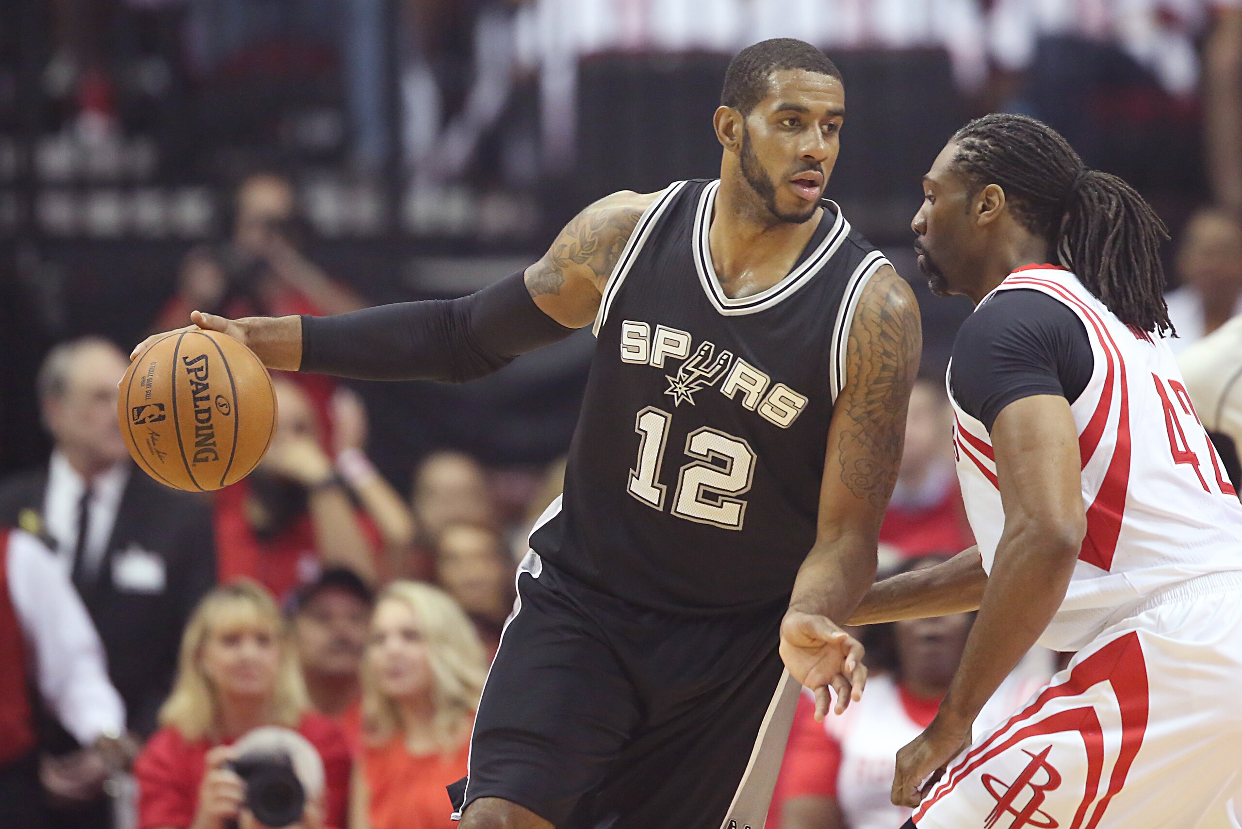 May 5, 2017; Houston, TX, USA; San Antonio Spurs forward LaMarcus Aldridge (12) drives against Houston Rockets center Nene Hilario (42) in the first quarter in game three of the second round of the 2017 NBA Playoffs at Toyota Center. Mandatory Credit: Tho