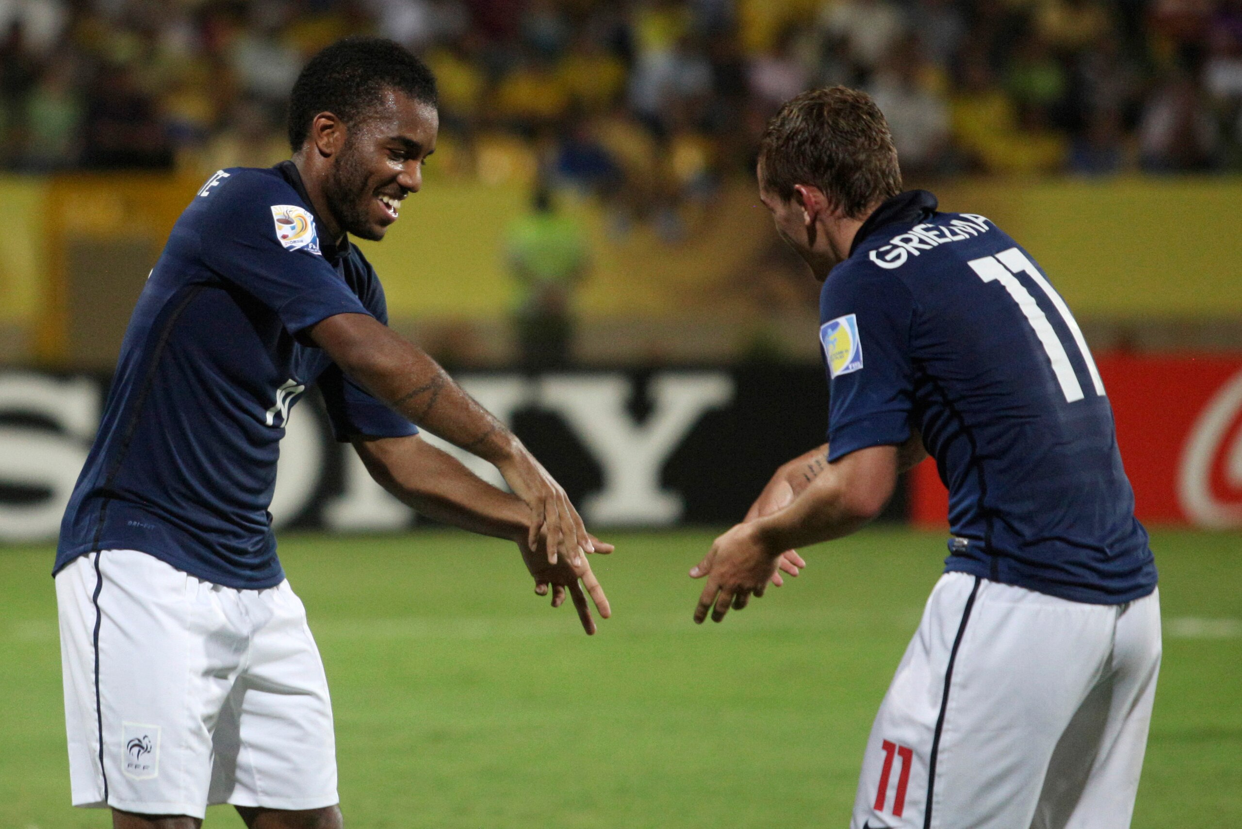 Lacazette and Antoine Griezmann, good friends off the pitch, celebrate a goal at the 2011 U-20 World Cup on it
