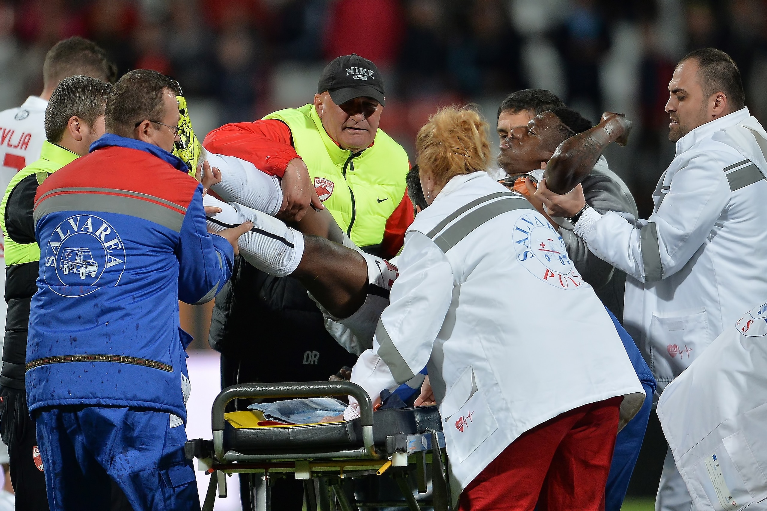 Ekeng is lifted from the pitch to a stretcher.