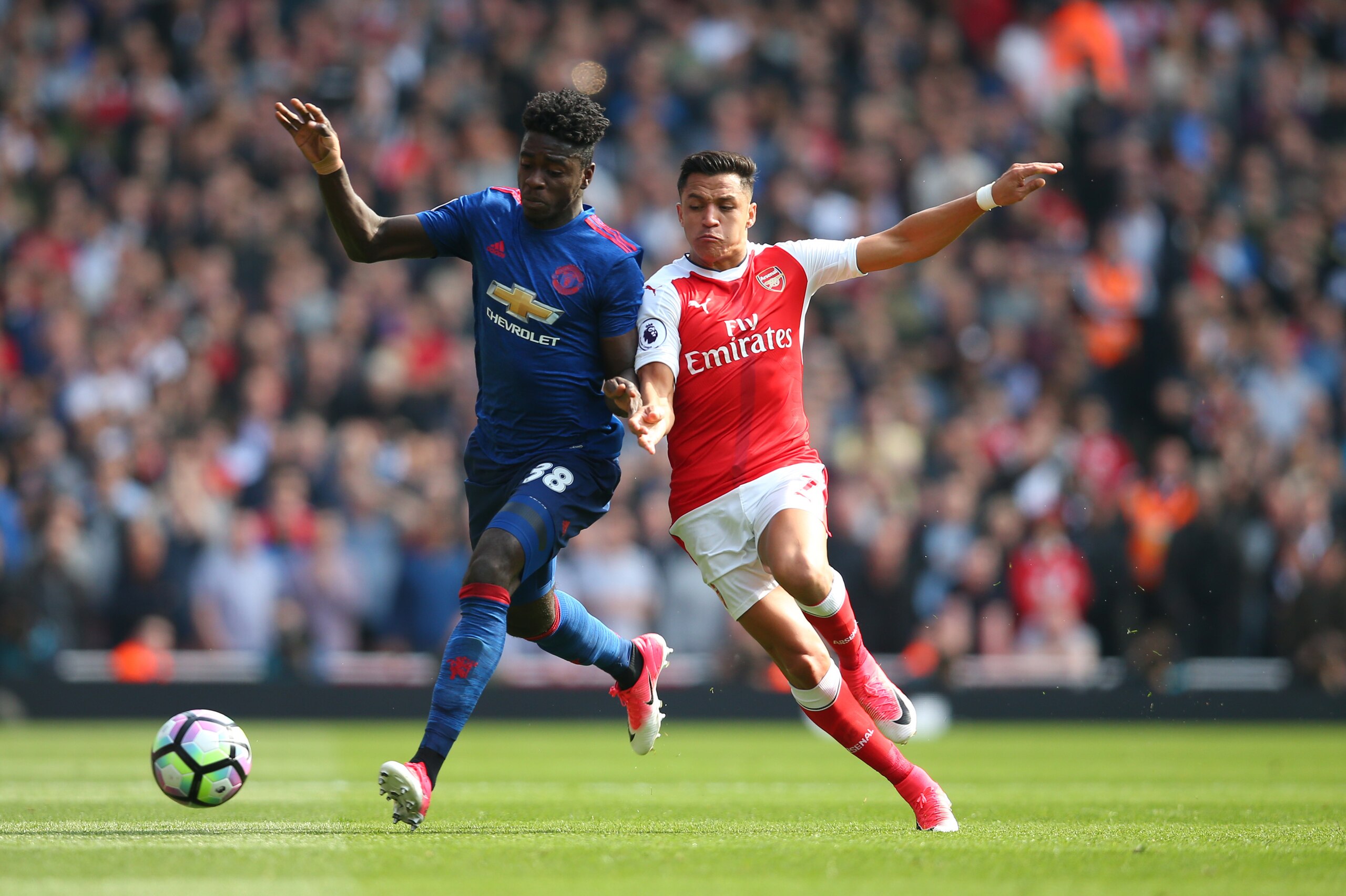 LONDON, ENGLAND - MAY 07: Axel Tuanzebe of Manchester United and Alexis Sanchez of Arsenal during the Premier League match between Arsenal and Manchester United at Emirates Stadium on May 7, 2017 in London, England. (Photo by Catherine Ivill - AMA/Getty I