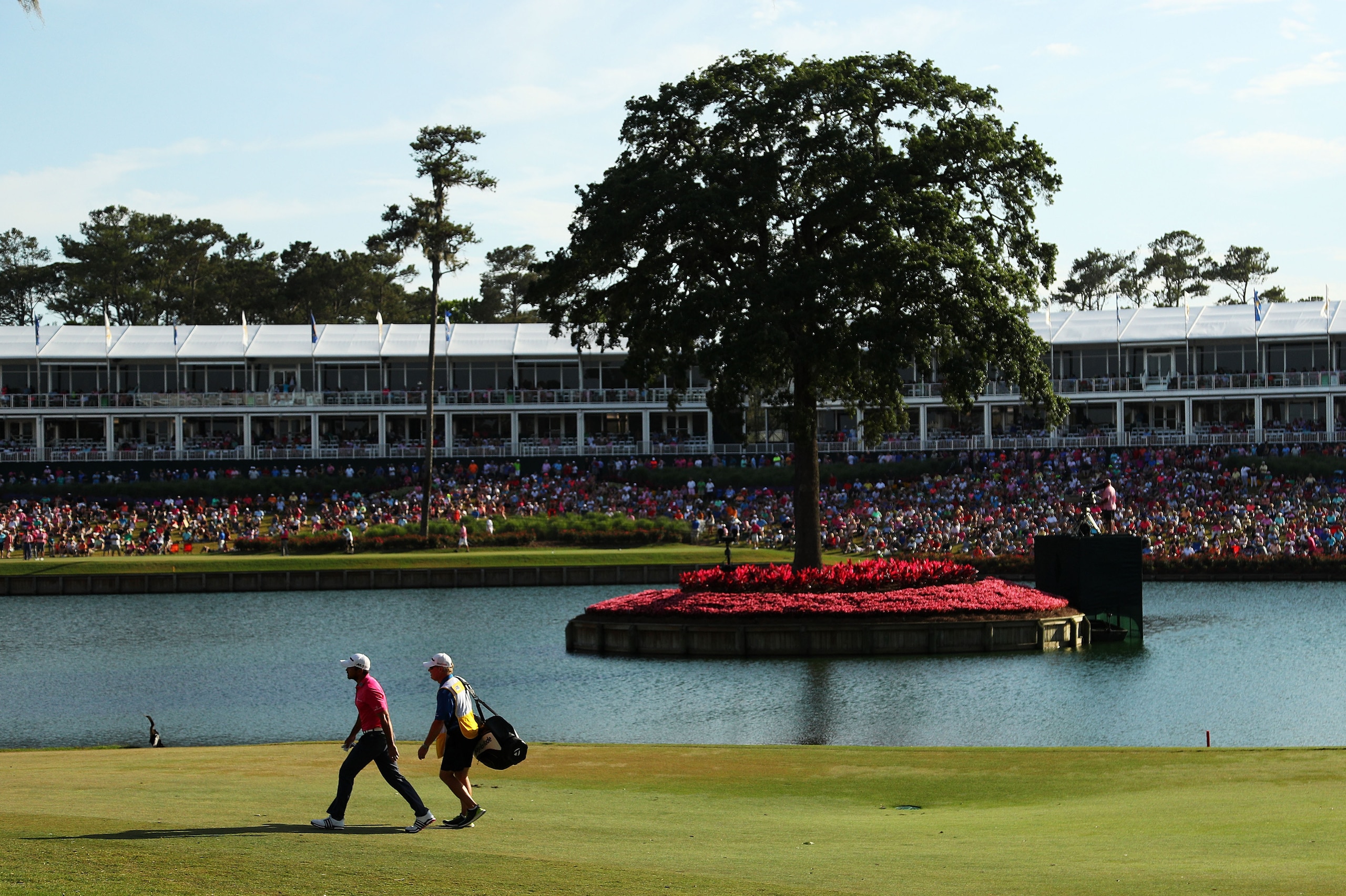 PONTE VEDRA BEACH, FL - MAY 15:  Jason Day of Australia and caddie Colin Swatton walk on the 16th hole during the final round of THE PLAYERS Championship at the Stadium course at TPC Sawgrass on May 15, 2016 in Ponte Vedra Beach, Florida.  (Photo by Mike 