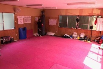 The modest gym in which Momo trains is only 600 square feet, but it has developed three successful pro fighters.