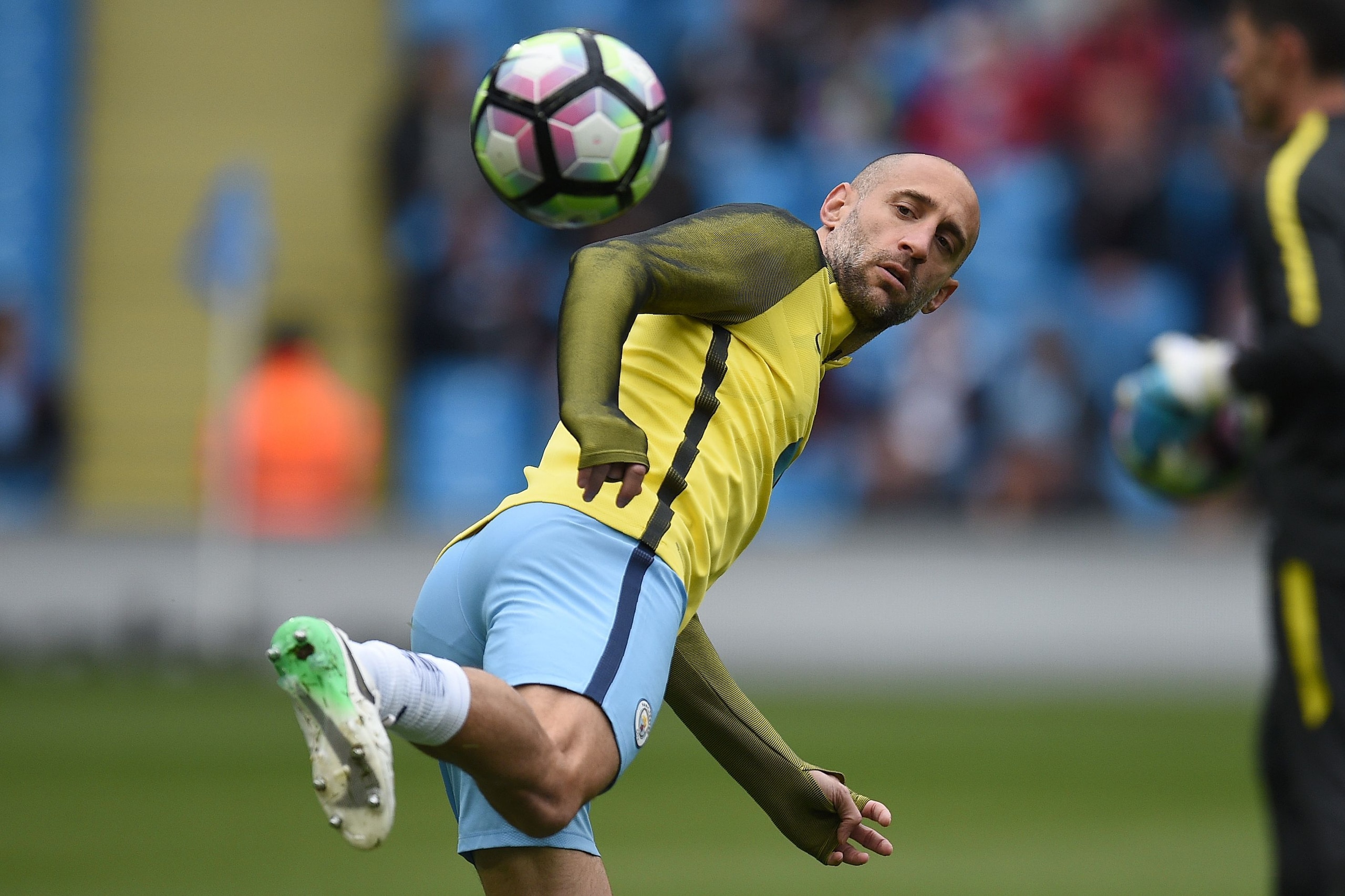 CORRECTION - Manchester City's Argentinian defender Pablo Zabaleta warms up ahead of the English Premier League football match between Manchester City and Crystal Palace at the Etihad Stadium in Manchester, north west England, on May 6, 2017. / AFP PHOTO 