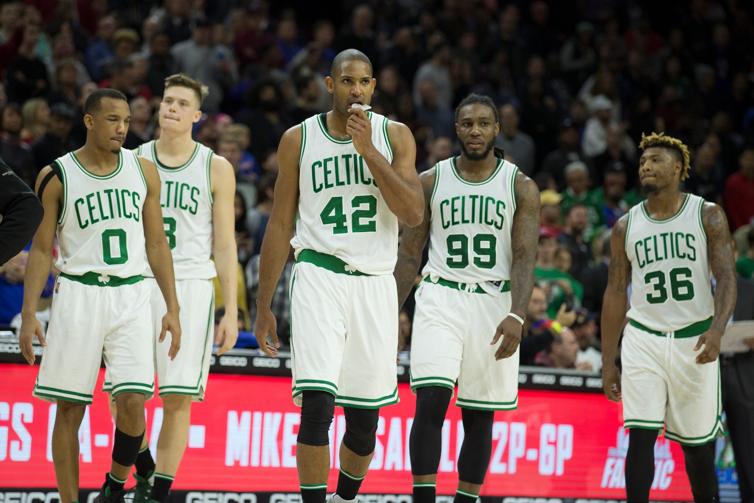 PHILADELPHIA, PA - DECEMBER 3: Avery Bradley #0, Jonas Jerebko #8, Al Horford #42, Jae Crowder #99, and Marcus Smart #36 of the Boston Celtics walk on the court after a timeout in the game against the Philadelphia 76ers at Wells Fargo Center on December 3