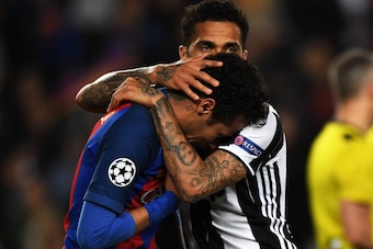 BARCELONA, SPAIN - APRIL 19: Neymar of Barcelona is consoled by Dani Alves of Juventus after the UEFA Champions League Quarter Final second leg match between FC Barcelona and Juventus at Camp Nou on April 19, 2017 in Barcelona, Spain. (Photo by Etsuo Hara