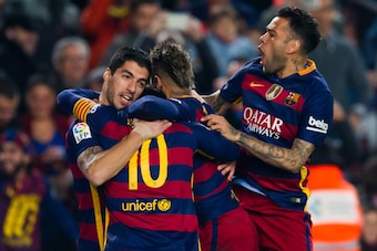 BARCELONA, SPAIN - JANUARY 27: Luis Suarez (L) of FC Barcelona celebrates with his teammates Lionel Messi (2nd L), Neymar Santos Jr (2nd R)) and Dani Alves (R) after scoring his team's first goal during the Copa del Rey Quarter Final Second Leg between FC