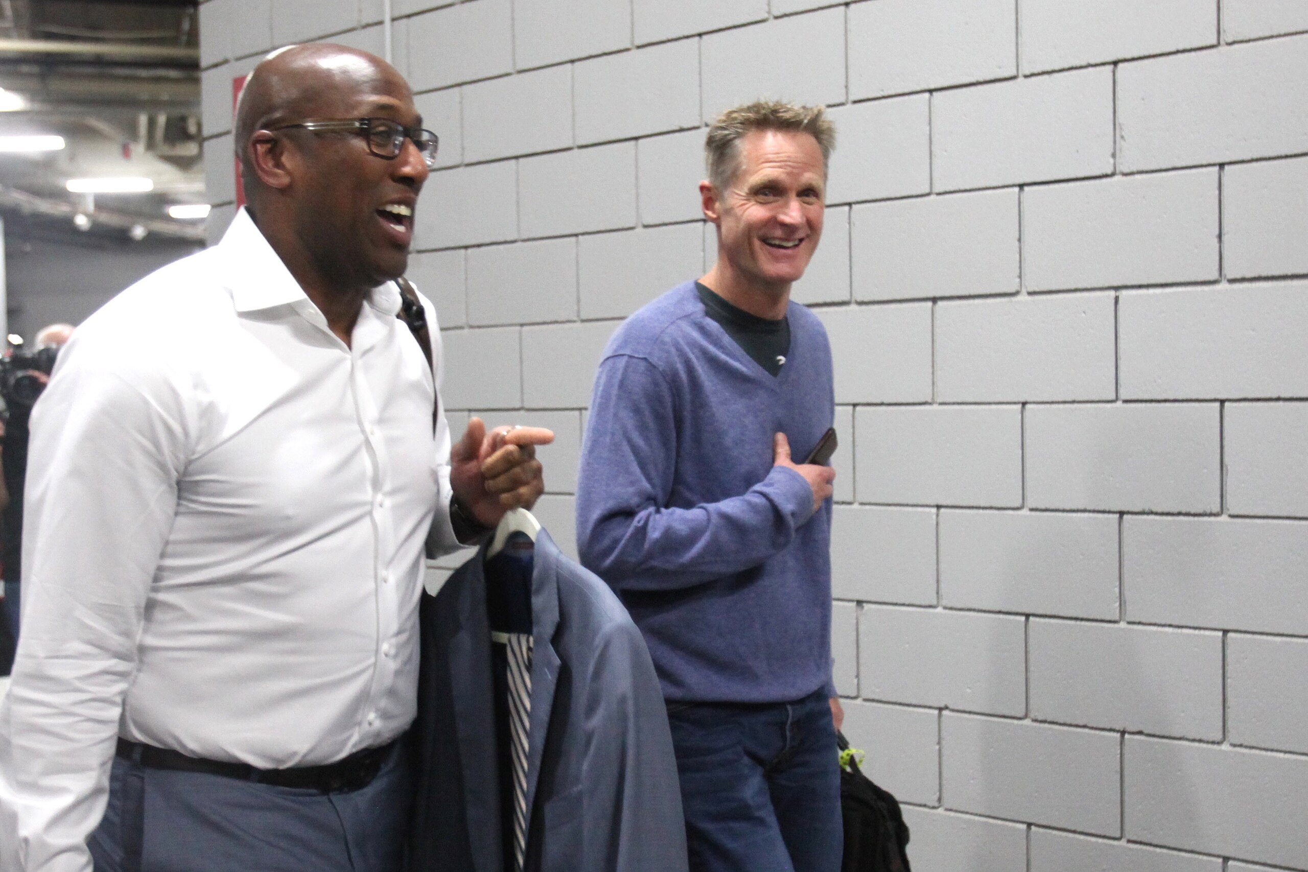 Apr 24, 2017; Portland, OR, USA; Golden State Warriors assistant coach Mike Brown (L) and head coach Steve Kerr (R) arrive at Moda Center for game four of the first round of the 2017 NBA Playoffs Portland Trail Blazers. Mandatory Credit: Jaime Valdez-USA 