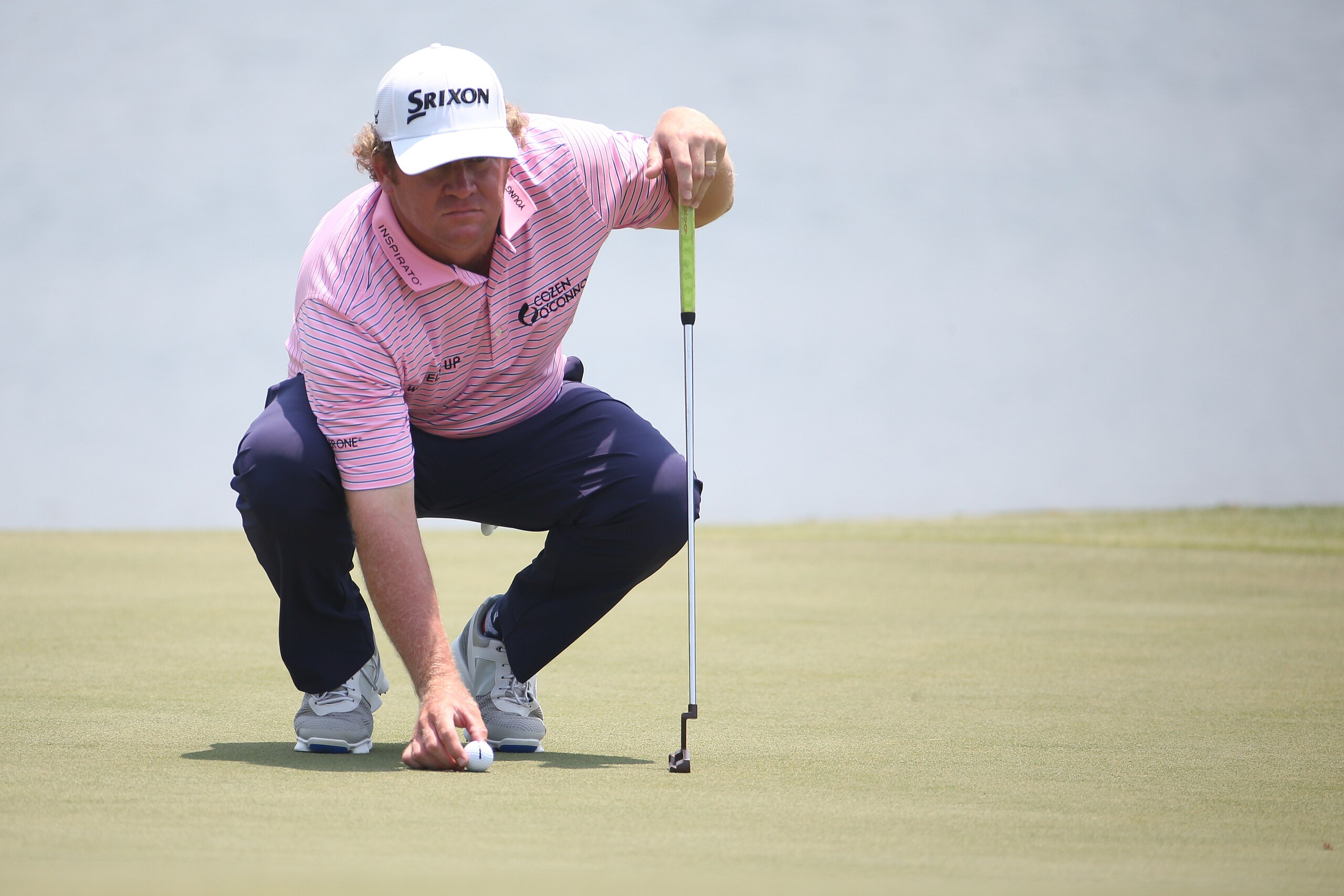 May 11, 2017; Ponte Vedra Beach, FL, USA; William McGirt lines up his putt on the 18th green during the first round of The Players Championship golf tournament at TPC Sawgrass - Stadium Course. Mandatory Credit: Peter Casey-USA TODAY Sports