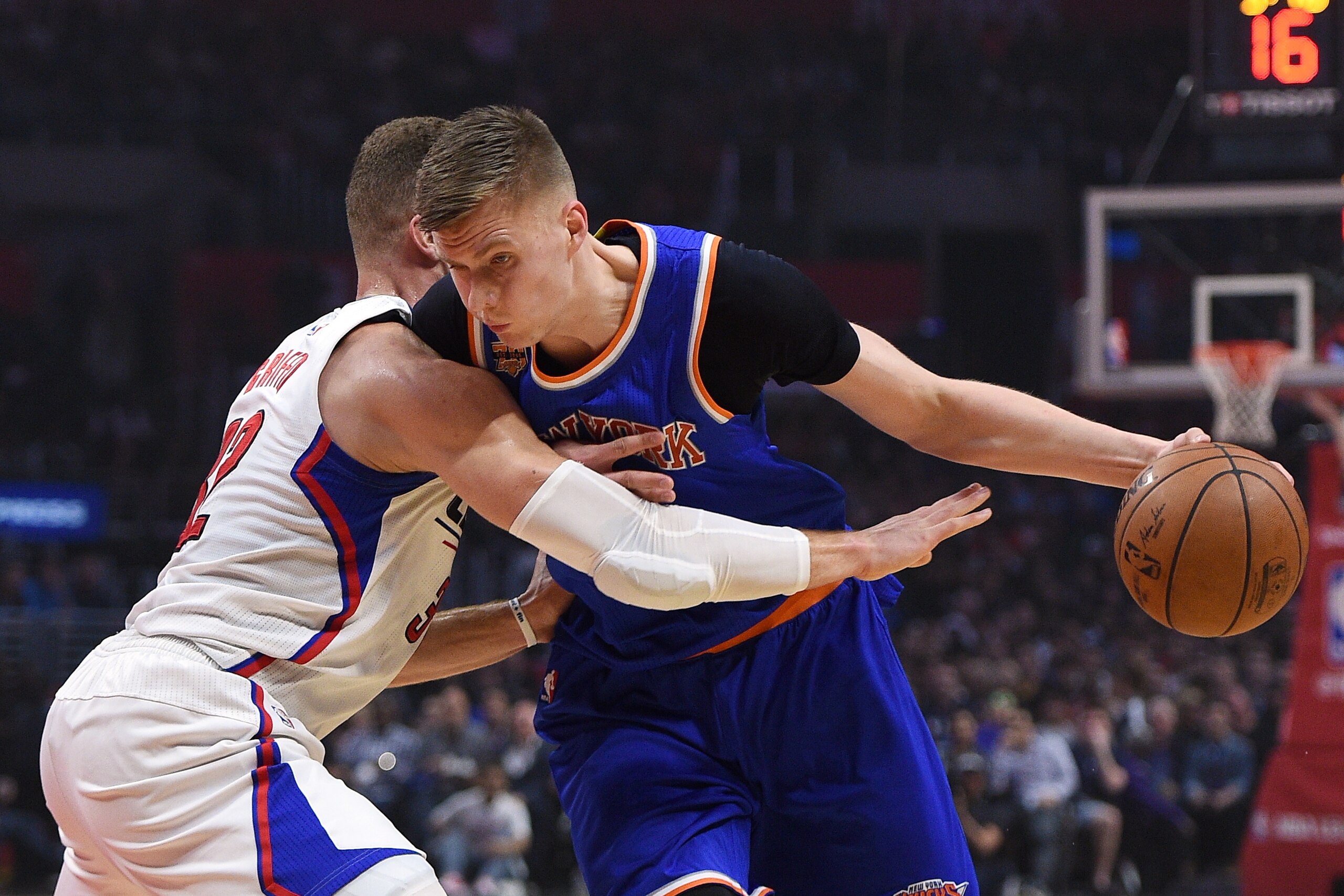 LOS ANGELES, CA - MARCH 20: Kristaps Porzingis #6 of the New York Knicks drives to the basket against  Blake Griffin #32 of the Los Angeles Clippers during the first half of a basketball game at Staples Center March 20, 2017, in Los Angeles, California. N