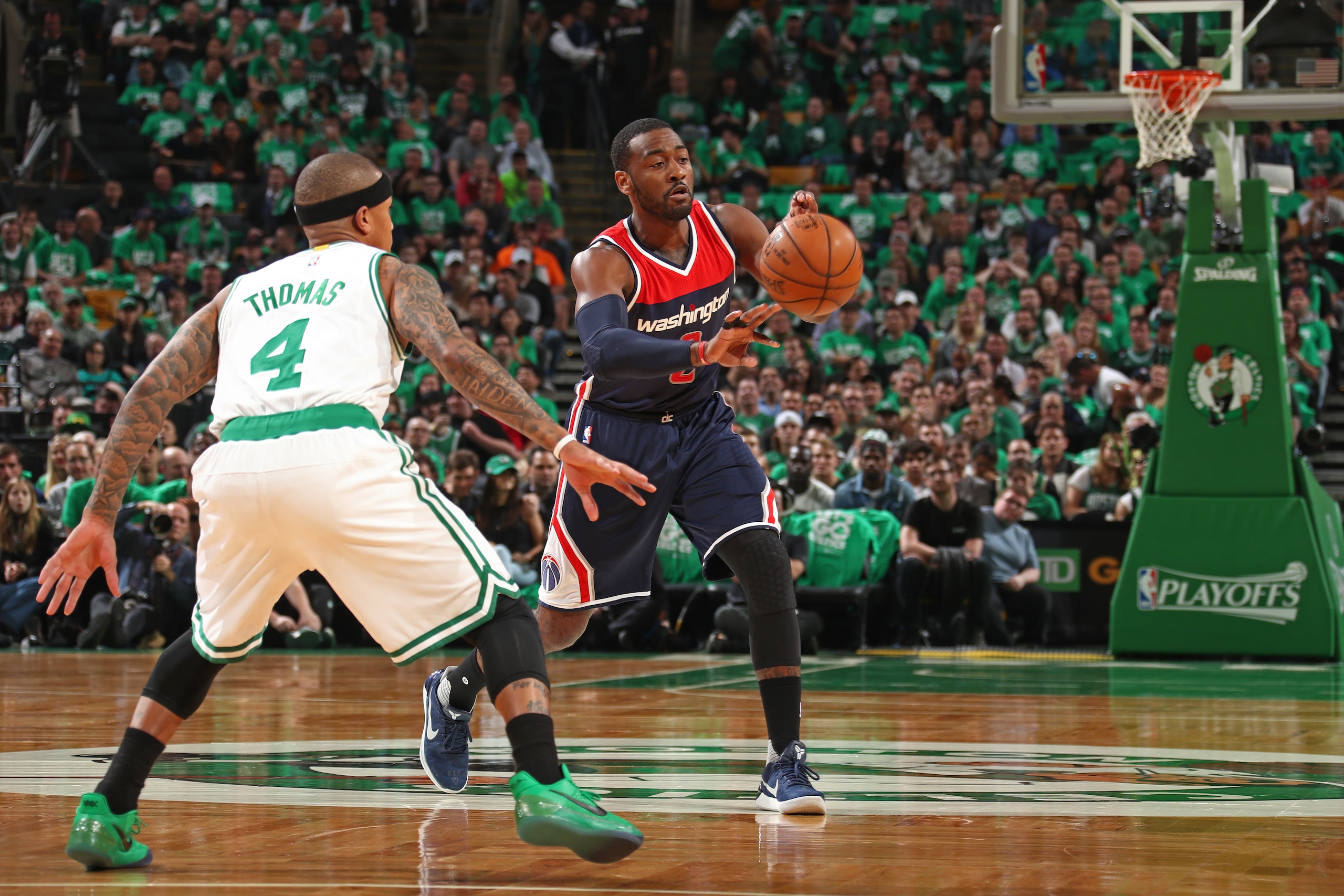 BOSTON, MA - MAY 10:  John Wall #2 of the Washington Wizards passes the ball while guarded by Isaiah Thomas #4 of the Boston Celtics in Game Five of the Eastern Conference Semifinals during the 2017 NBA Playoffs on May 10, 2017 at the TD Garden in Boston,