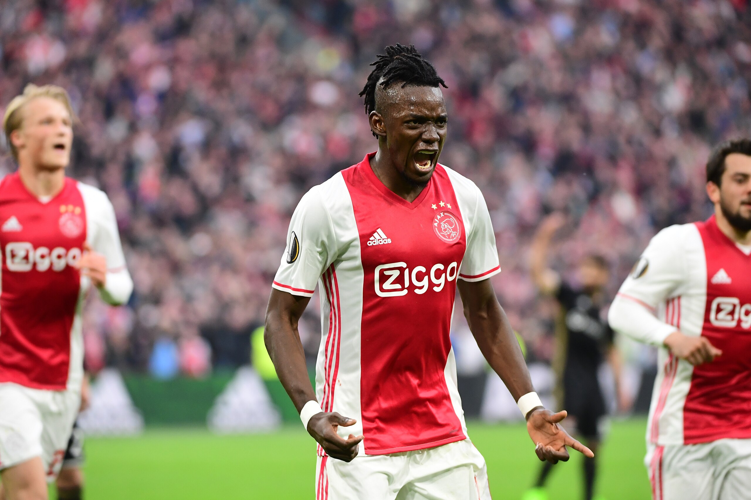 Ajax forward Bertrand Traoré (C) reacts after fourth goal during UEFA Europa League semi-final, first leg, Ajax Amsterdam v Olympique Lyonnais on May 3, 2017 in Amsterdam.  / AFP PHOTO / Emmanuel DUNAND        (Photo credit should read EMMANUEL DUNAND/AFP