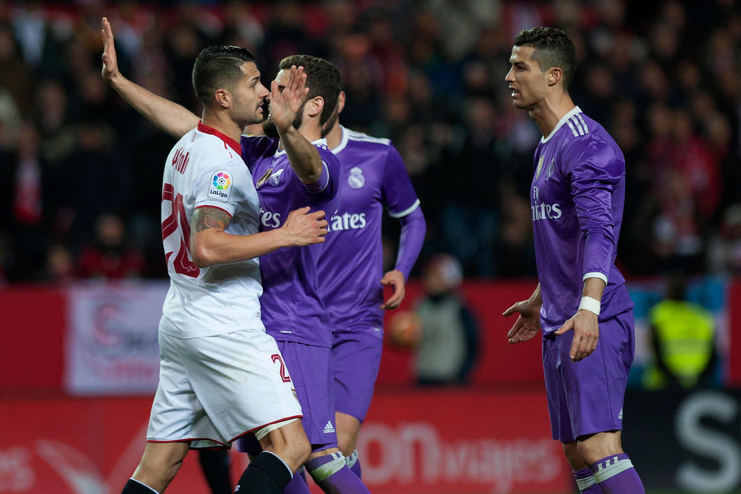 Sevilla's midfielder Vitolo (L) speaks with Real Madrid's Portuguese forward Cristiano Ronaldo  during the Spanish league football match Sevilla FC vs Real Madrid CF at the Ramon Sanchez Pizjuan stadium in Sevilla on January 15, 2017.
Sevilla won 2-1. / A