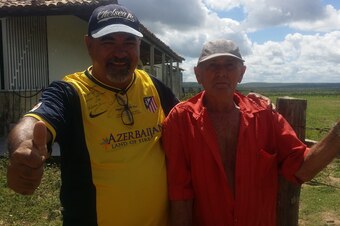 Flavio (left) wearing the signed shirt Costa gave him, pictured with Ze Bento