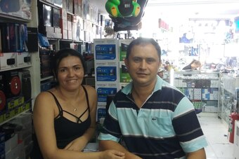Edson and his wife in their shop in Sao Paulo