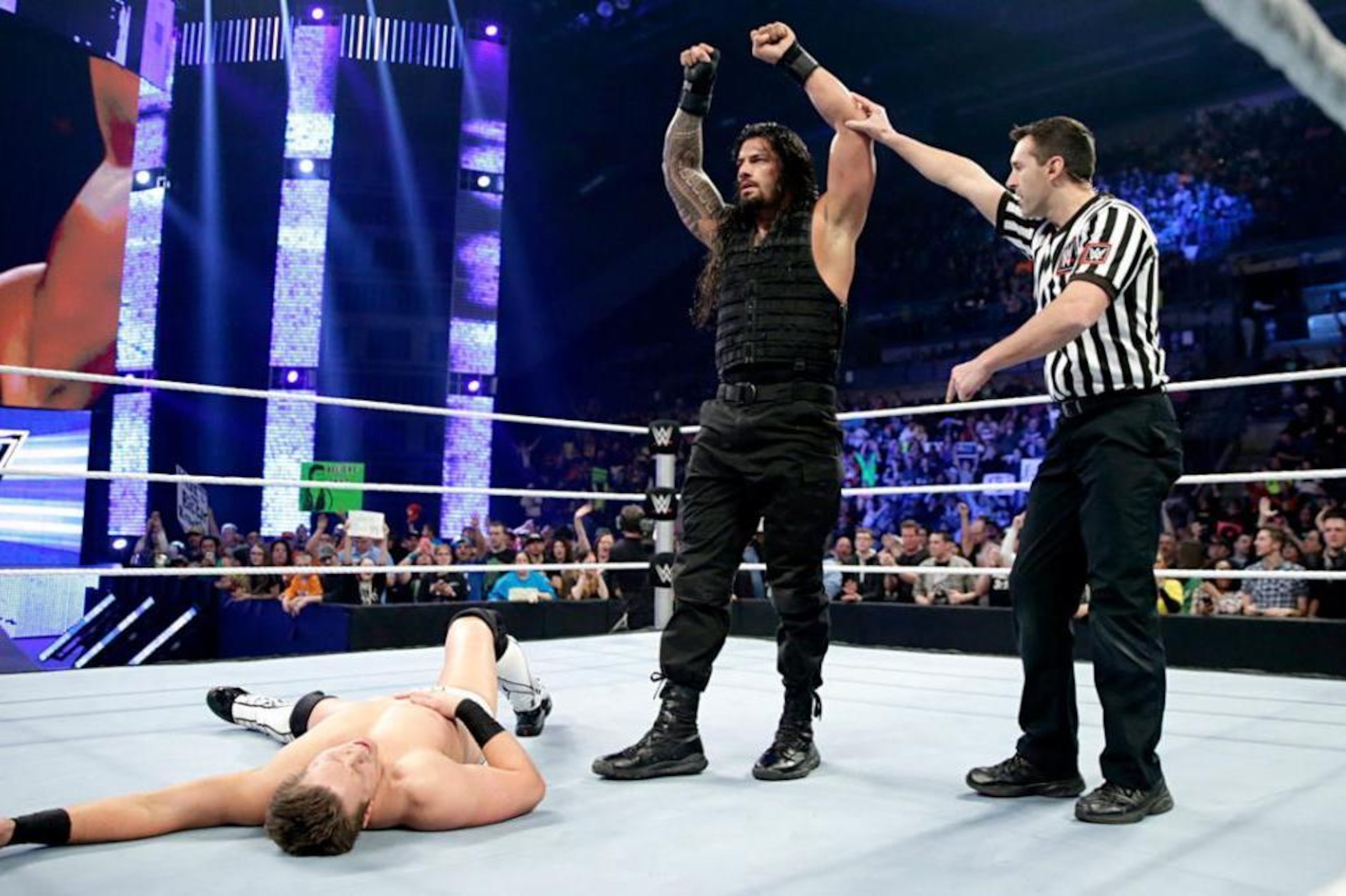 Roman Reigns celebrates a win over The Miz on SmackDown in 2015.