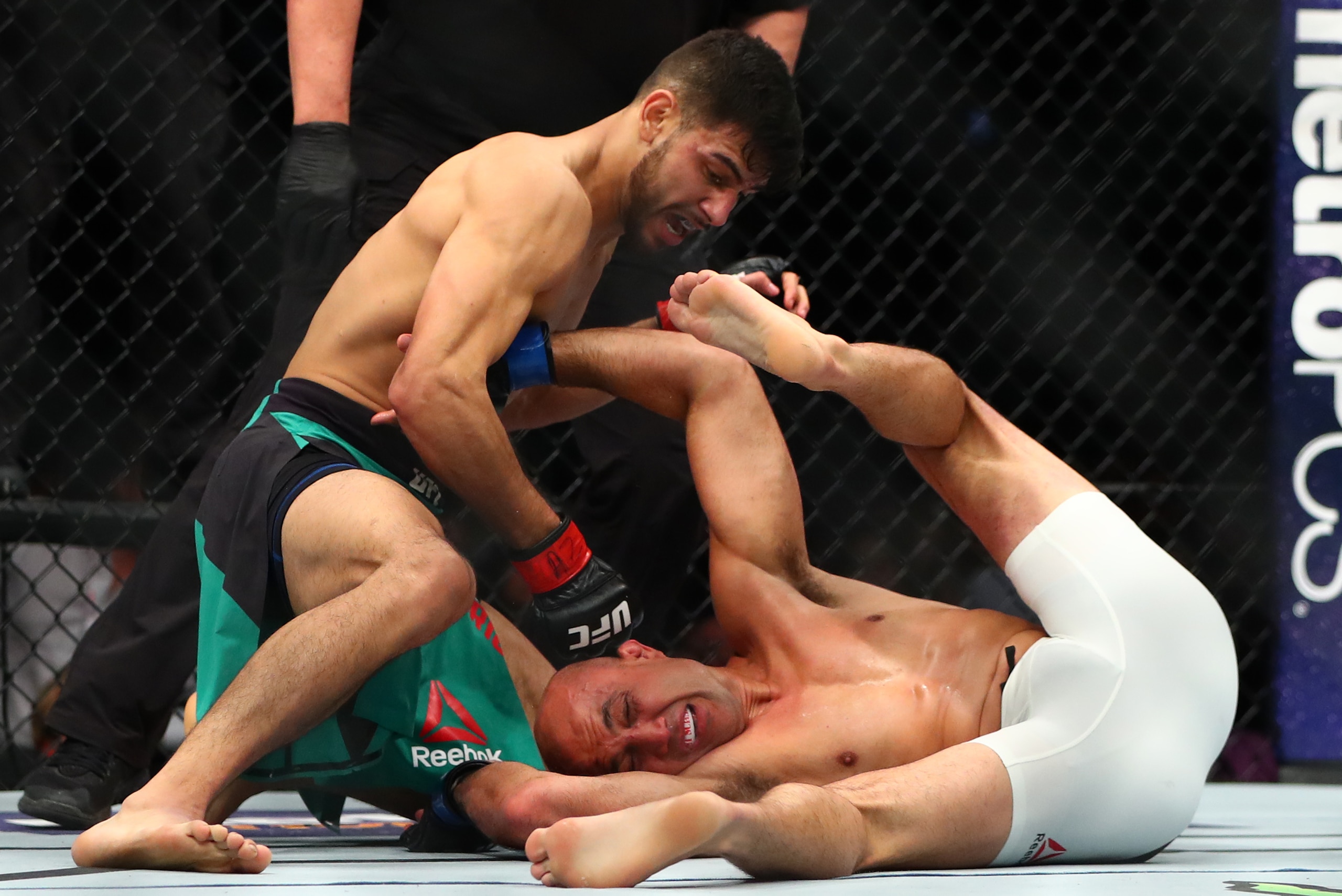Jan 15, 2017; Phoenix, AZ, USA; Yair Rodriguez (top) punches B.J. Penn during UFC Fight Night at Talking Stick Resort Arena. Mandatory Credit: Mark J. Rebilas-USA TODAY Sports
