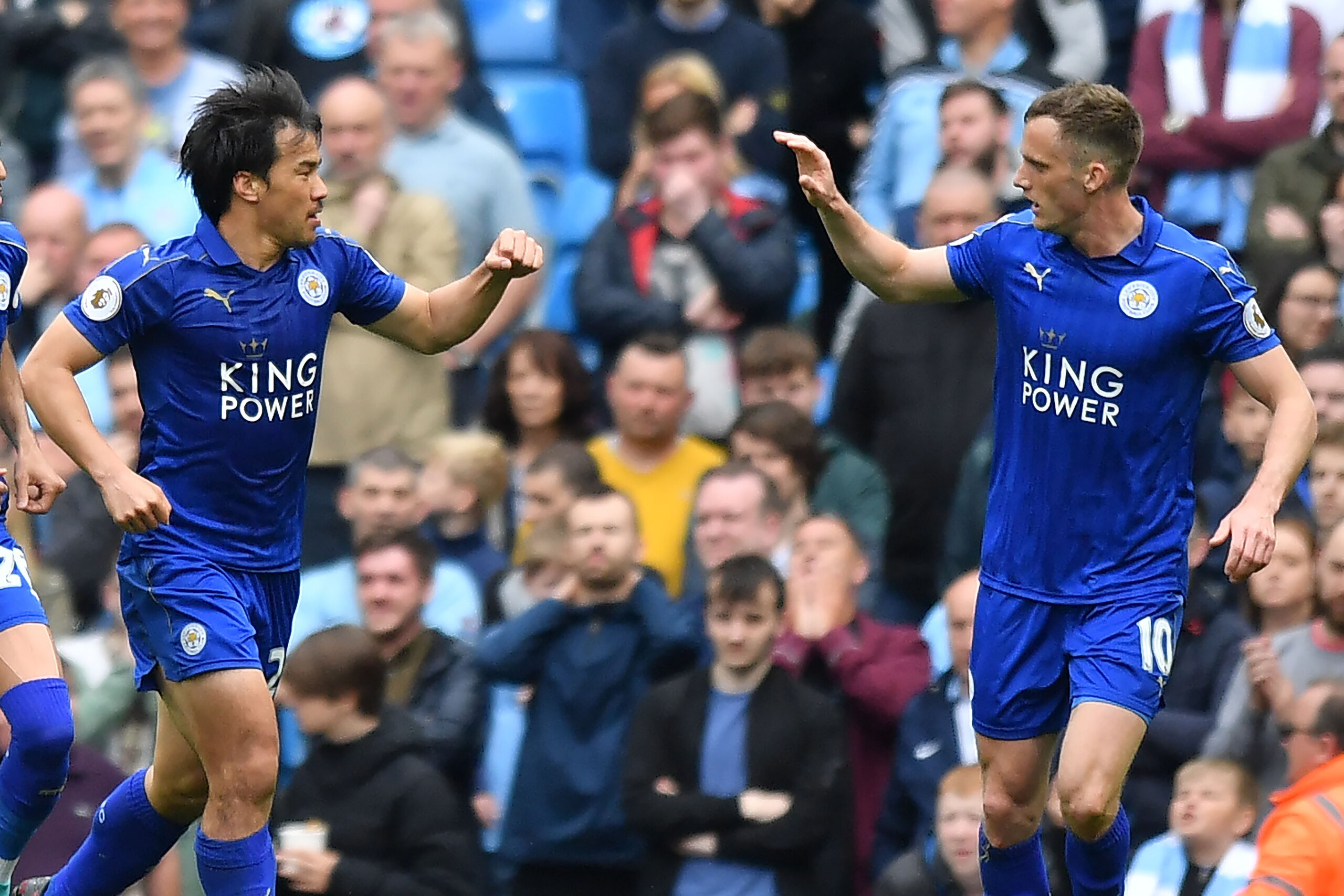 Leicester City's Japanese striker Shinji Okazaki (L) celebrates scoring their first goal during the English Premier League football match between Manchester City and Leicester City at the Etihad Stadium in Manchester, north west England, on May 13, 2017. Leicester City's Japanese striker Shinji Okazaki (L) celebrates scoring their first goal during the English Premier League football match between Manchester City and Leicester City at the Etihad Stadium in Manchester, north west England, on May 13, 2017.