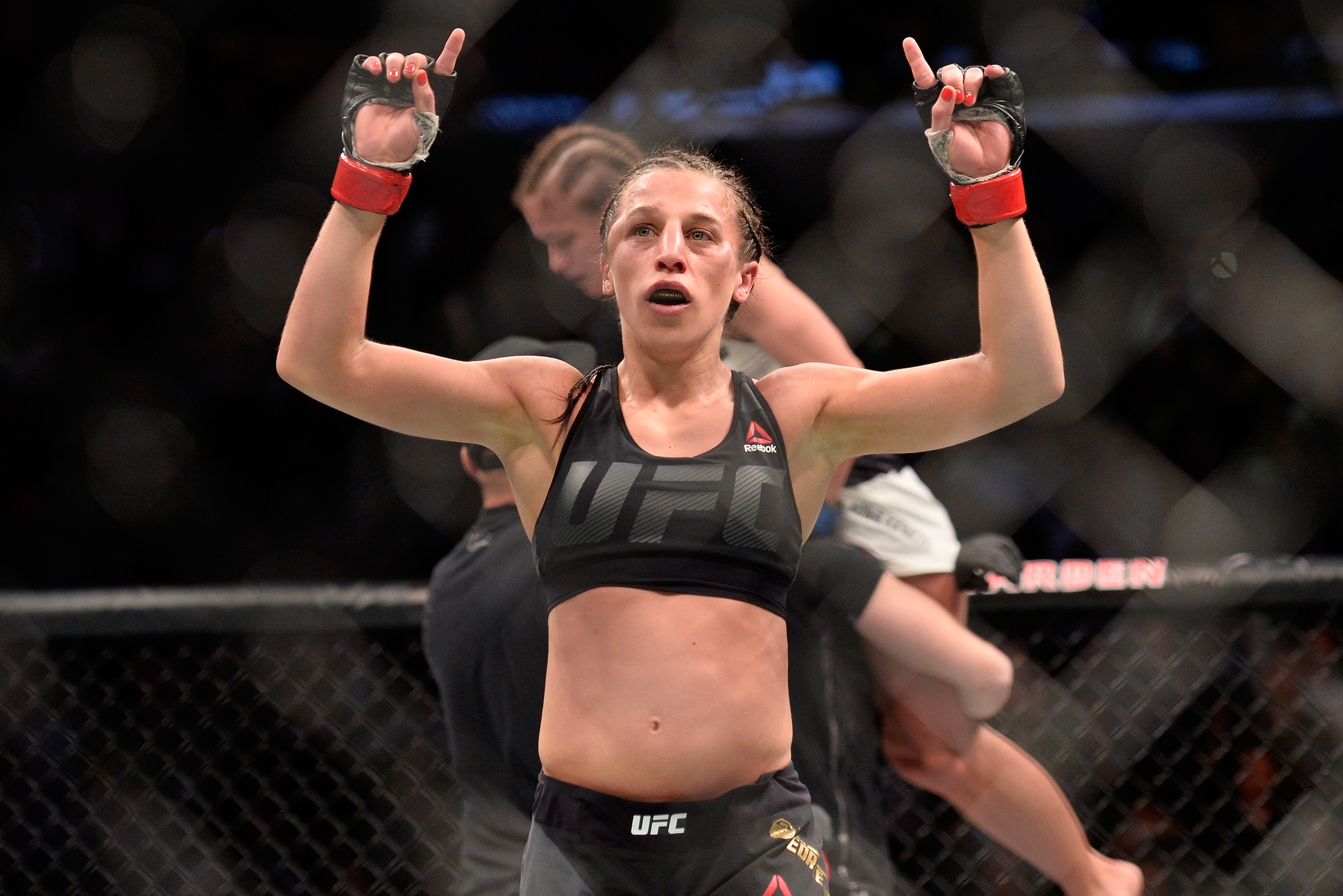 NEW YORK, NY - NOVEMBER 12:  (L-R) Joanna Jedrzejczyk of Poland raises her hands after facing Karolina Kowalkiewicz of Poland in their UFC women's strawweight championship fight during the UFC 205 event at Madison Square Garden on November 12, 2016 in New