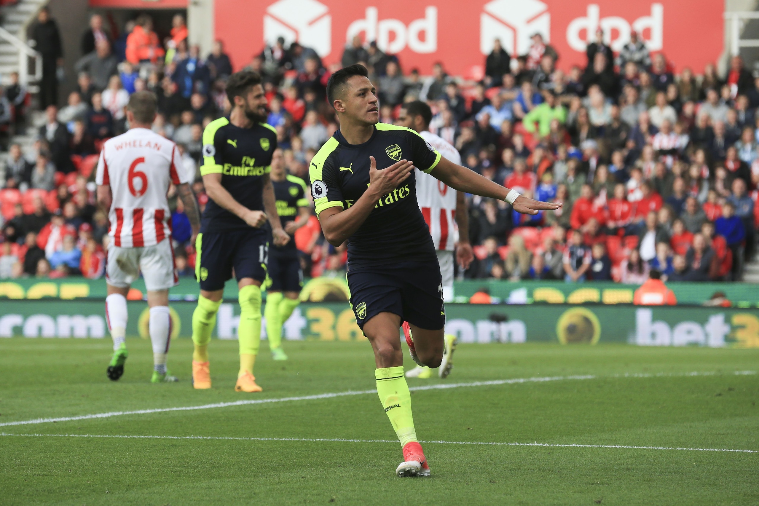 Arsenal's Chilean striker Alexis Sanchez celebrates after scoring their third goal during the English Premier League football match between Stoke City and Arsenal at the Bet365 Stadium in Stoke-on-Trent, central England on May 13, 2017.
Arsenal won the ga