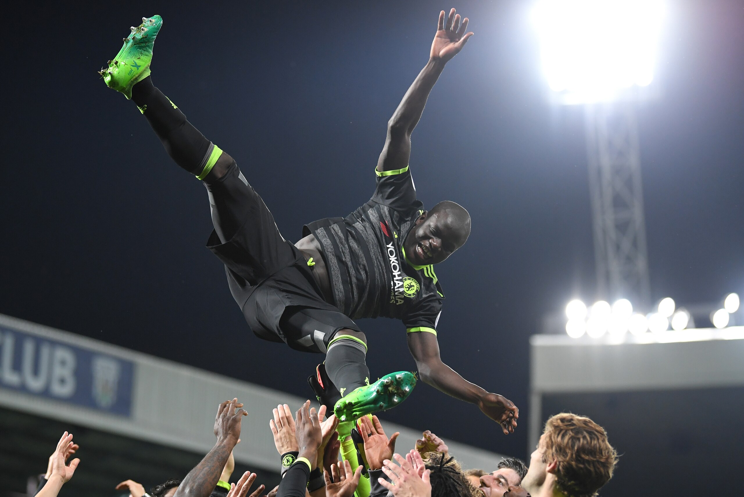 WEST BROMWICH, ENGLAND - MAY 12: N'Golo Kante of Chelsea is thrown into the air in celebration after winning the title after the Premier League match between West Bromwich Albion and Chelsea at The Hawthorns on May 12, 2017 in West Bromwich, England.  (Ph