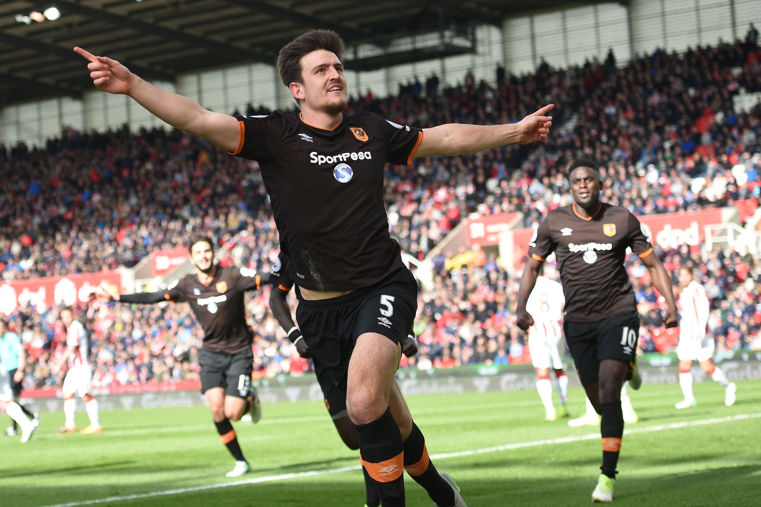 Hull City's English defender Harry Maguire celebrates scoring Hull's first goal during the English Premier League football match between Stoke City and Hull City at the Bet365 Stadium in Stoke-on-Trent, central England on April 15, 2017. / AFP PHOTO / Oli