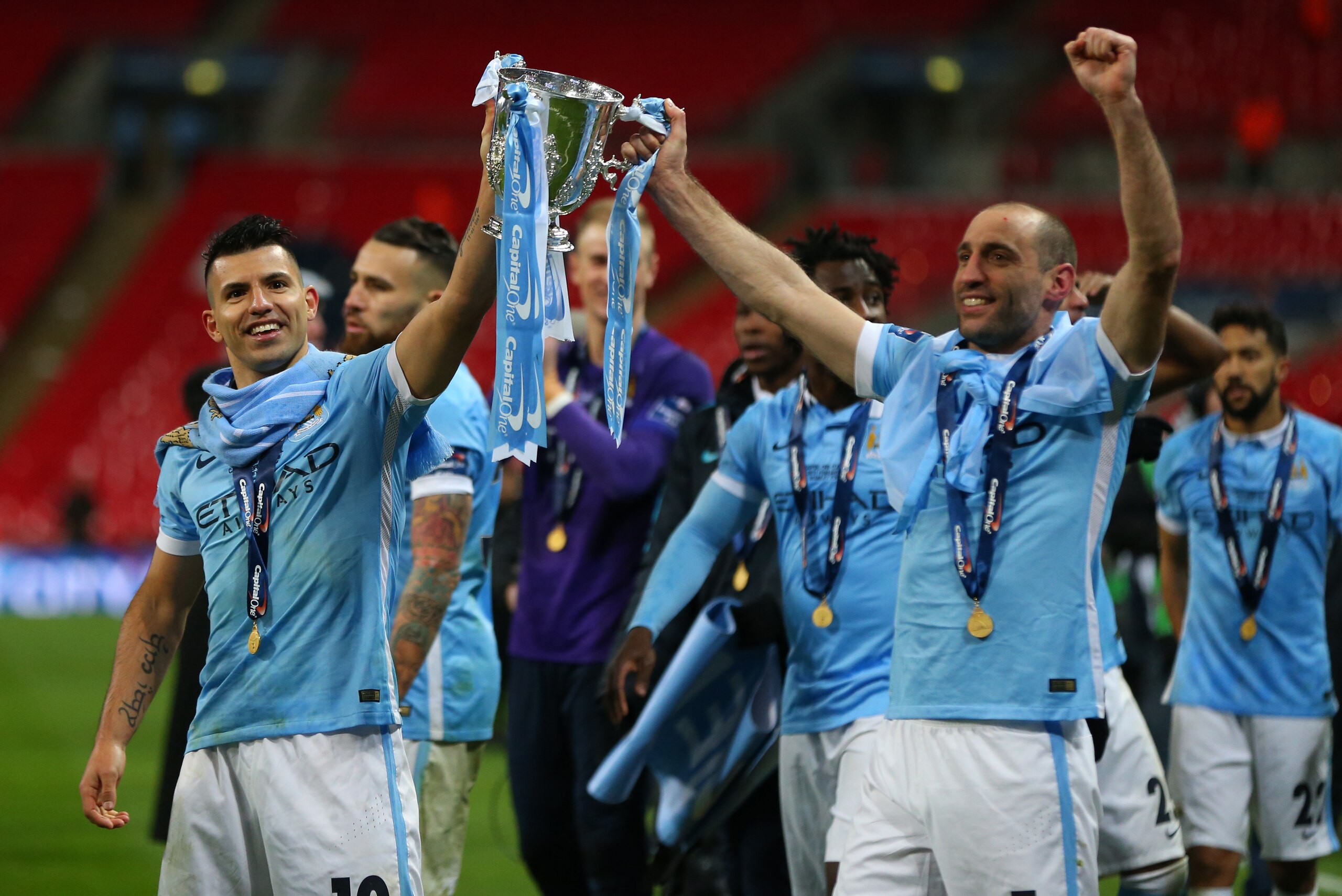LONDON, ENGLAND - FEBRUARY 28 :  Sergio Aguero and Pablo Zabaleta of Manchester City celebrate with the trophy after the Capital One Cup Final match between Liverpool and Manchester City at Wembley Stadium on February 28, 2016 in London, England.  (Photo 
