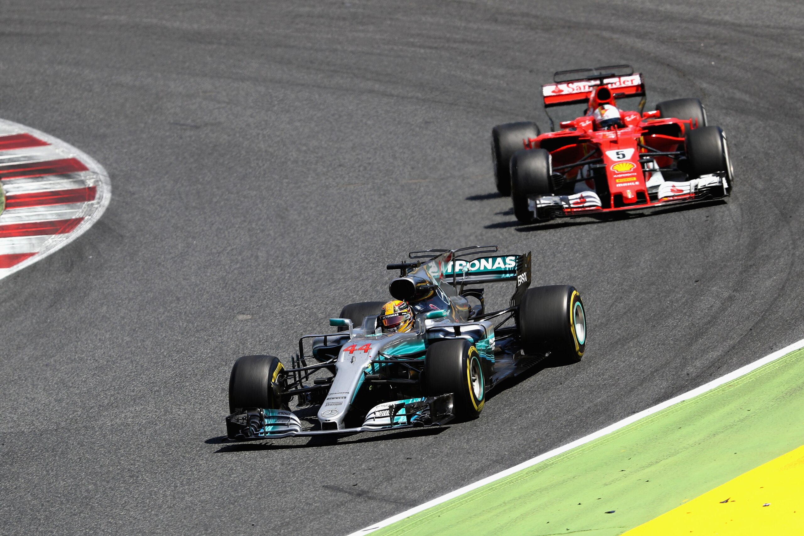 MONTMELO, SPAIN - MAY 14: Lewis Hamilton of Great Britain driving the (44) Mercedes AMG Petronas F1 Team Mercedes F1 WO8 leads Sebastian Vettel of Germany driving the (5) Scuderia Ferrari SF70H on track during the Spanish Formula One Grand Prix at Circuit