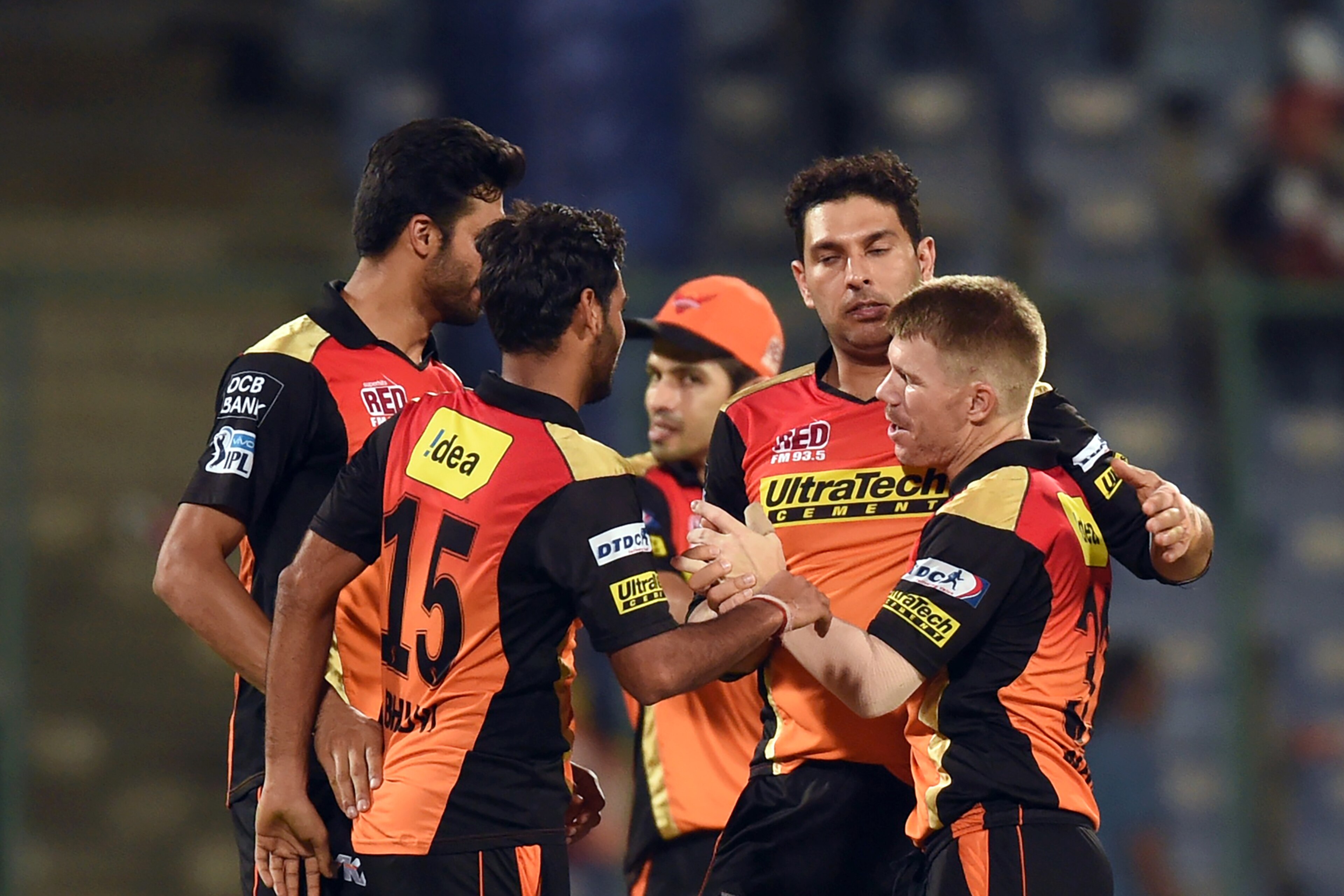 Sunrisers Hyderabad captain David Warner (R) celebrates the victory over Kolkata Knight Riders with teammates  during the 2016 Indian Premier League (IPL) Twenty20 eliminator cricket match between Kolkata Knight Riders and Sunrisers Hyderabad at the Feroz