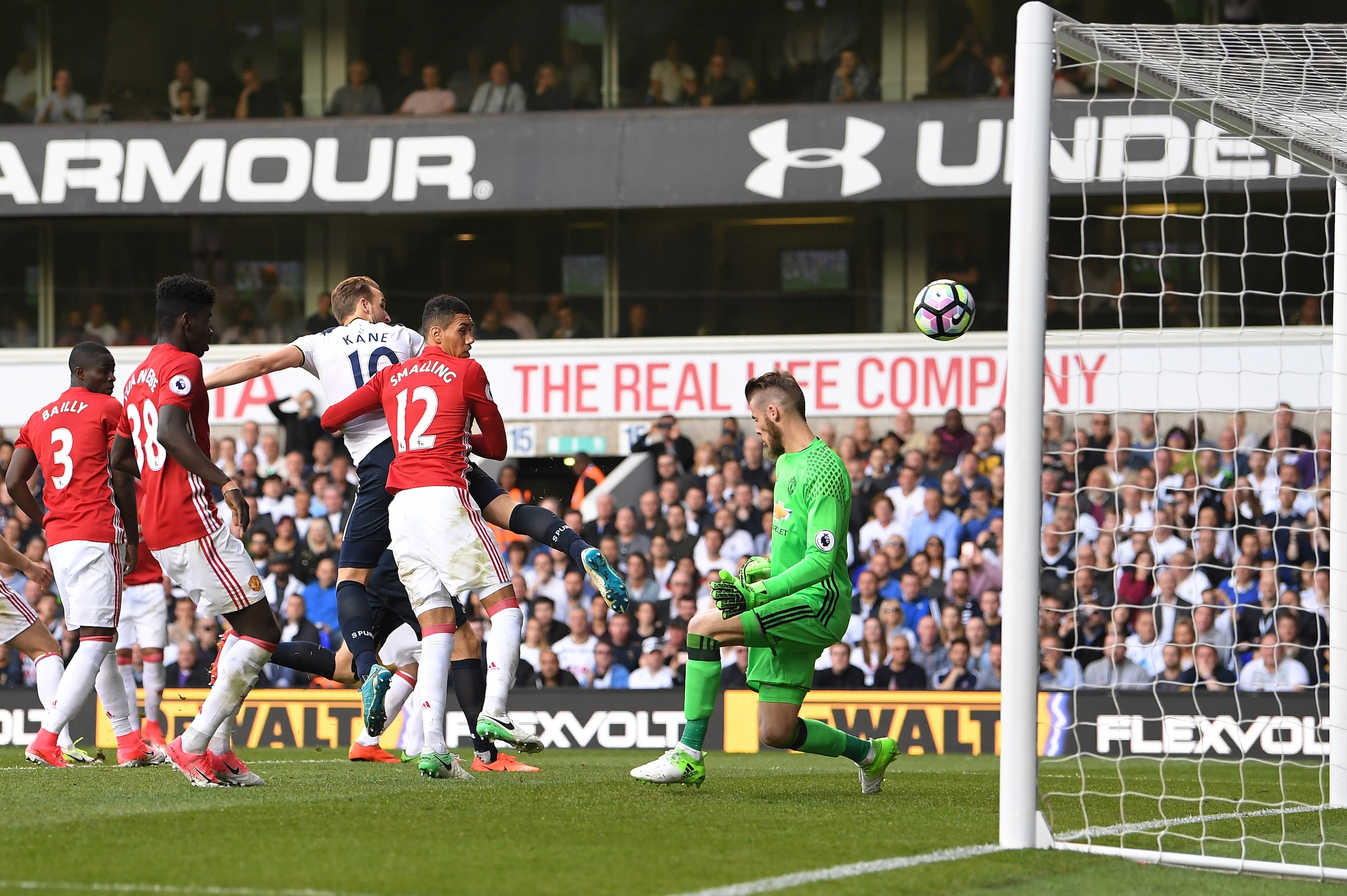 LONDON, ENGLAND - MAY 14:  Harry Kane of Tottenham Hotspur scores his sides second goal past David De Gea of Manchester United during the Premier League match between Tottenham Hotspur and Manchester United at White Hart Lane on May 14, 2017 in London, En