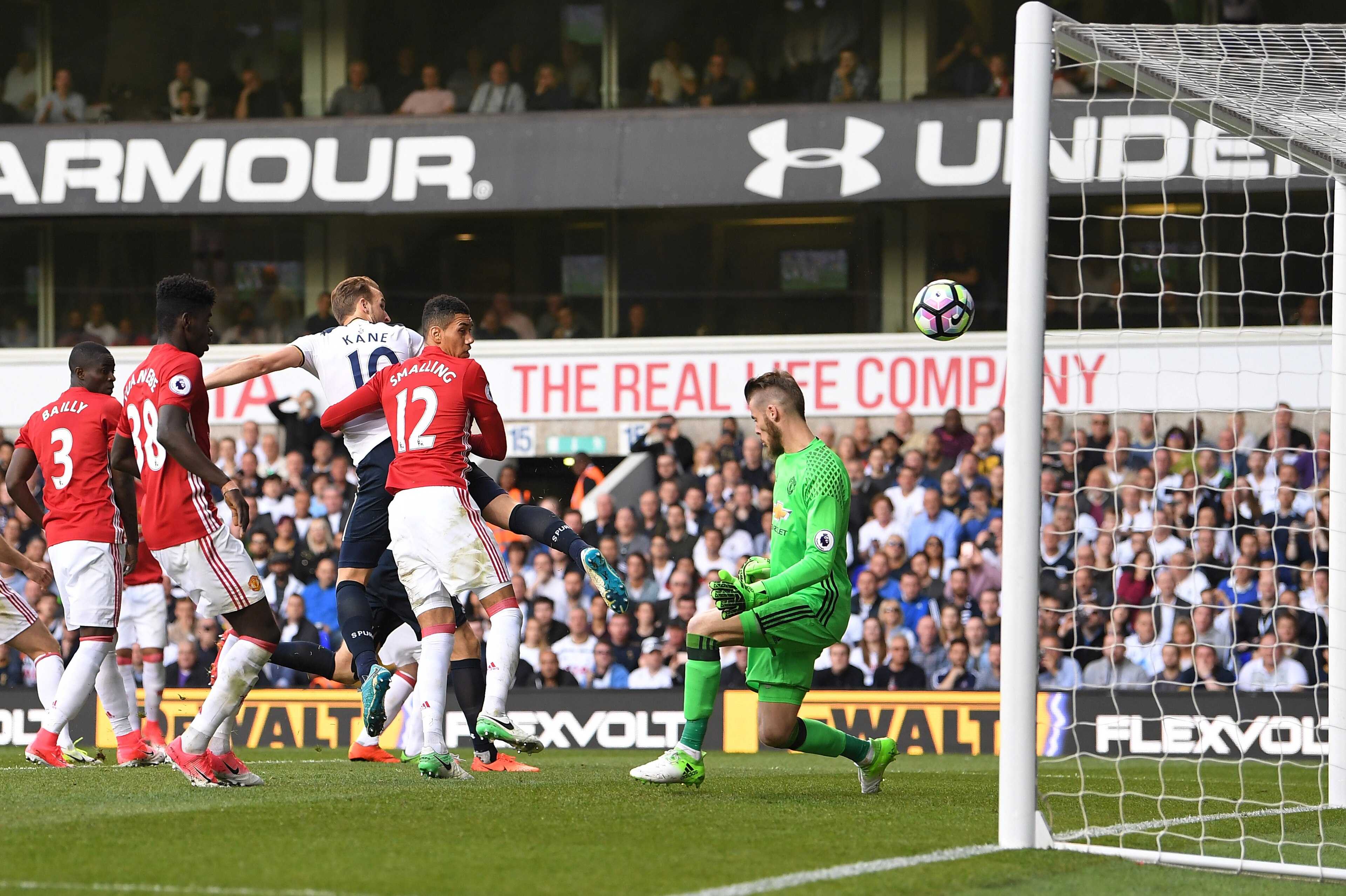 LONDON, ENGLAND - MAY 14:  Harry Kane of Tottenham Hotspur scores his sides second goal past David De Gea of Manchester United during the Premier League match between Tottenham Hotspur and Manchester United at White Hart Lane on May 14, 2017 in London, En