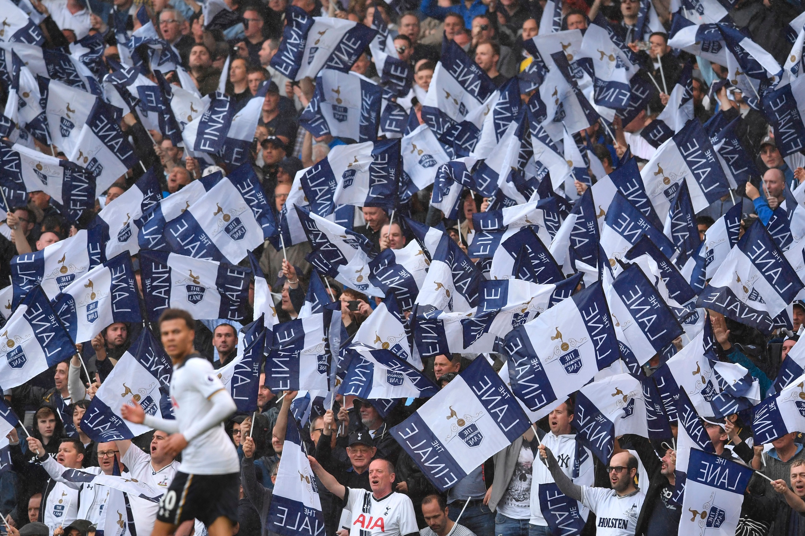 Fans hold up special 'Finale' flags in the crowd during the English Premier League football match between Tottenham Hotspur and Manchester United at White Hart Lane in London, on May 14, 2017. / AFP PHOTO / Ben STANSALL / RESTRICTED TO EDITORIAL USE. No u