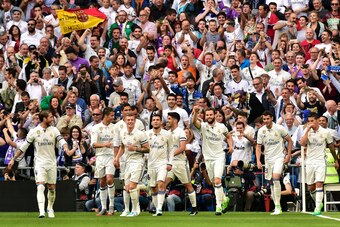 Real Madrid's defender Nacho Fernandez (3R) celebrates a goal with teammates during the Spanish league football match Real Madrid CF vs Sevilla FC at the Santiago Bernabeu stadium in Madrid on May 14, 2017. / AFP PHOTO / GERARD JULIEN        (Photo credit
