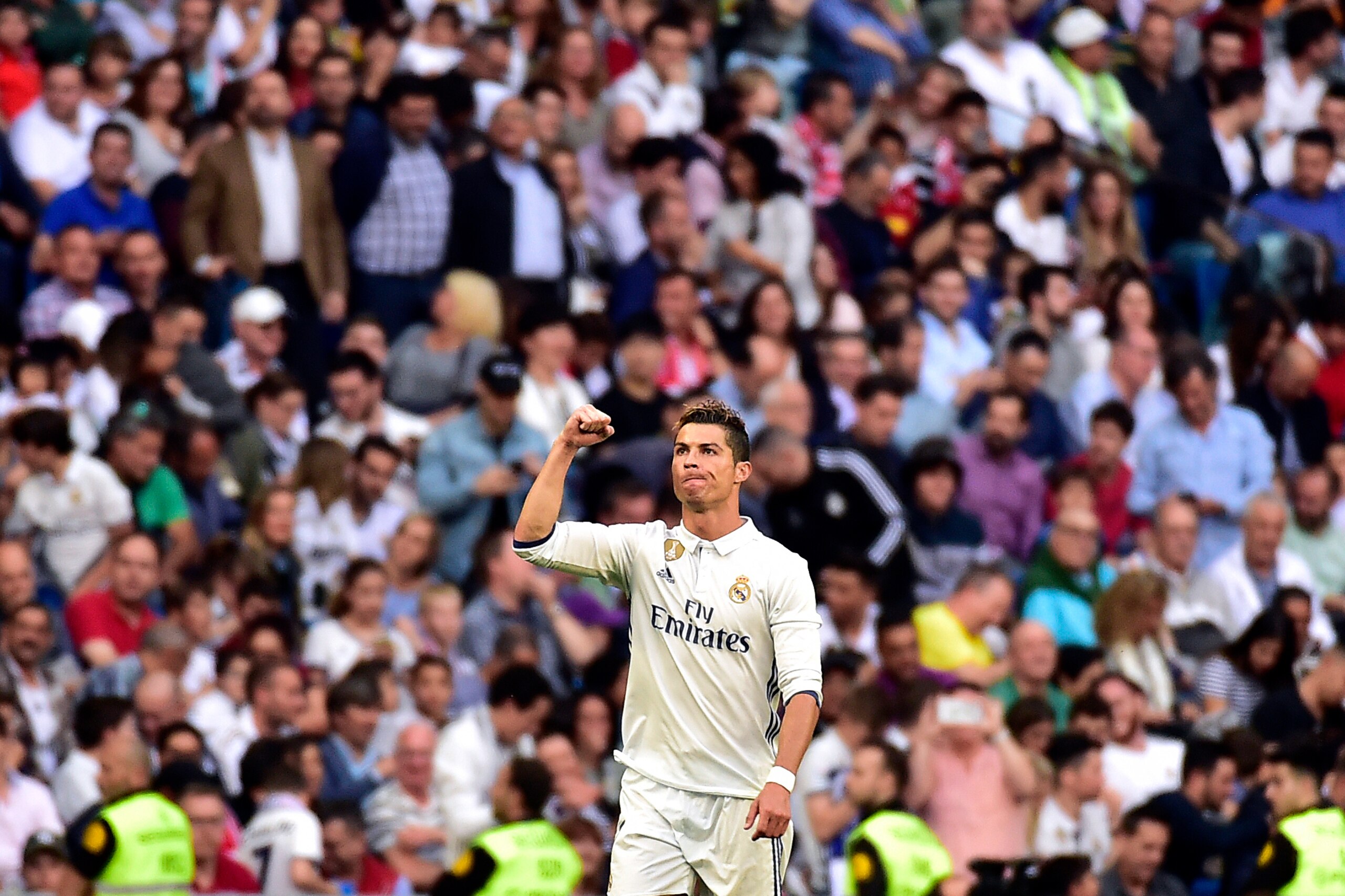 Real Madrid's Portuguese forward Cristiano Ronaldo celebrates after scoring during the Spanish league football match Real Madrid CF vs Sevilla FC at the Santiago Bernabeu stadium in Madrid on May 14, 2017. / AFP PHOTO / GERARD JULIEN (Photo credit Real Madrid's Portuguese forward Cristiano Ronaldo celebrates after scoring during the Spanish league football match Real Madrid CF vs Sevilla FC at the Santiago Bernabeu stadium in Madrid on May 14, 2017. / AFP PHOTO / GERARD JULIEN (Photo credit