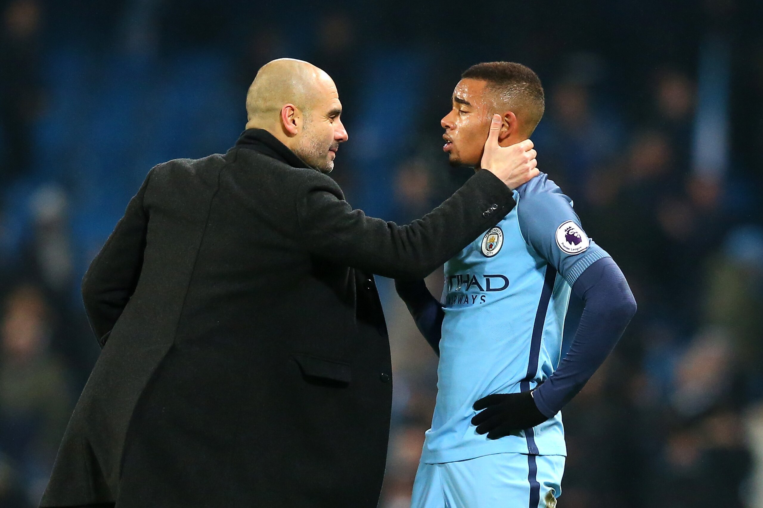MANCHESTER, ENGLAND - JANUARY 21:  Josep Guardiola, Manager of Manchester City (L) speaks to Gabriel Jesus of Manchester City (R) on the pitch after the Premier League match between Manchester City and Tottenham Hotspur at the Etihad Stadium on January 21
