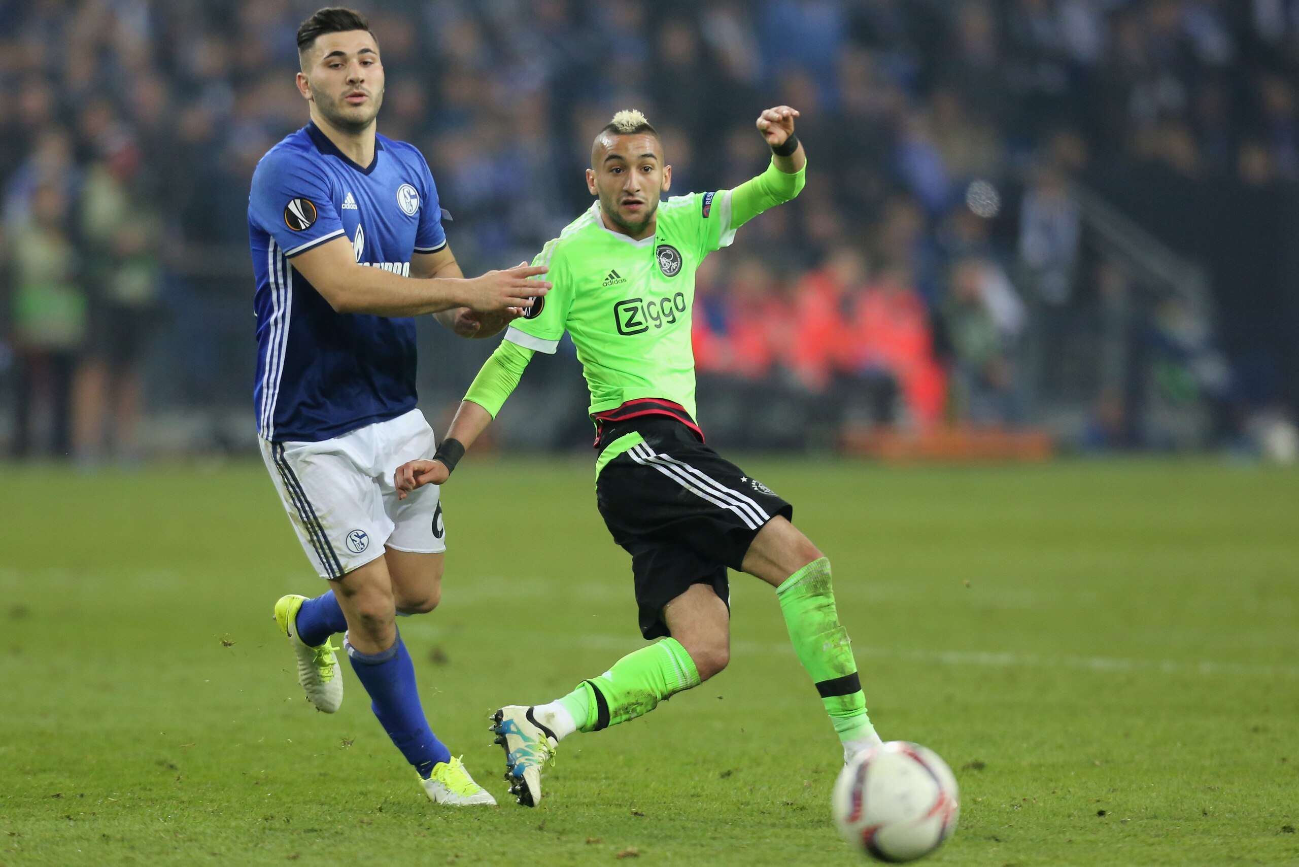 GELSENKIRCHEN, GERMANY - APRIL 20: Sead Kolasinac of Schalke and Hakim Ziyech of Ajax Amsterdam battle for the ball during the UEFA Europa League quarter final second leg match between FC Schalke 04 and Ajax Amsterdam at Veltins-Arena on April 20, 2017 in