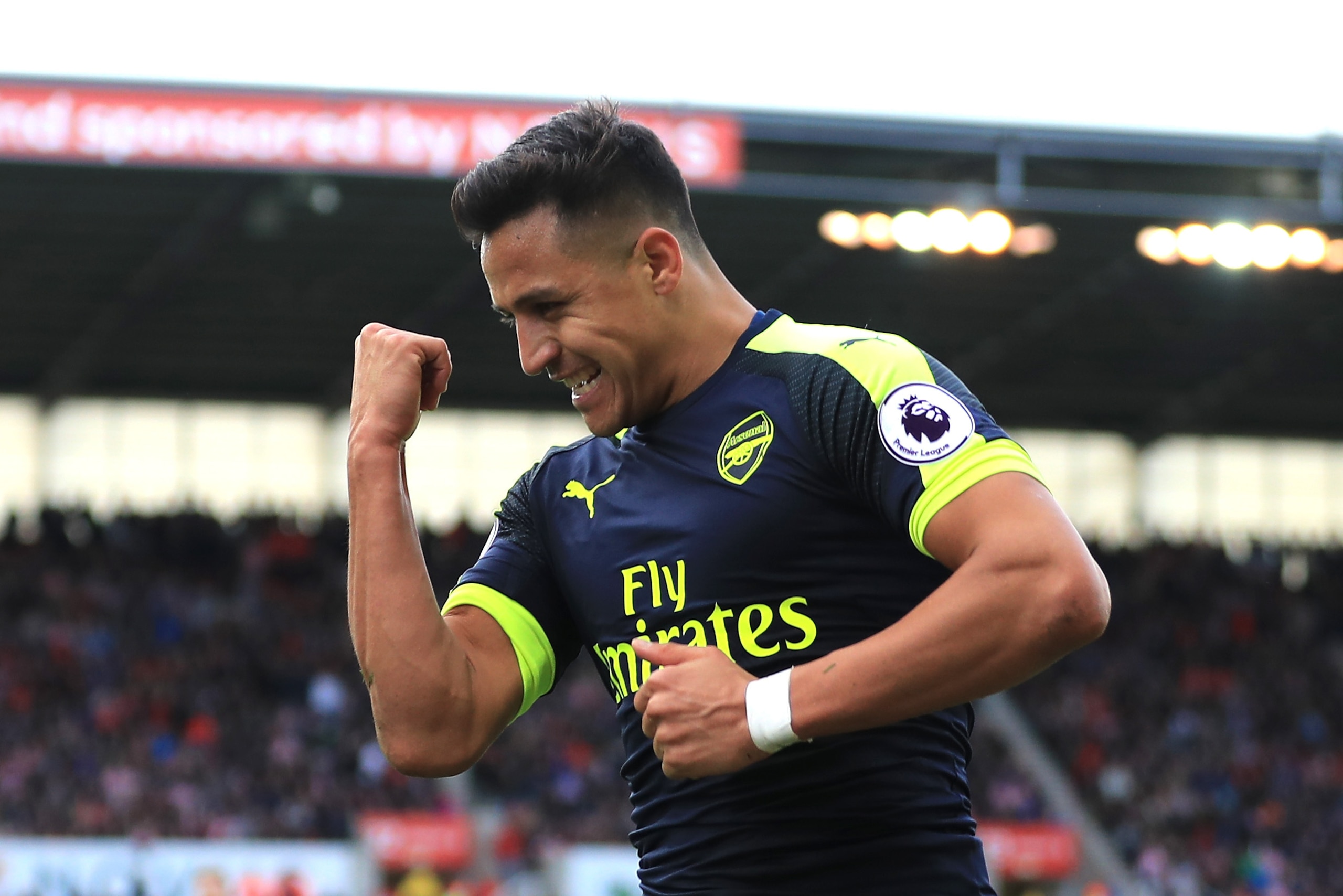 STOKE ON TRENT, ENGLAND - MAY 13:  Alexis Sanchez of Arsenal celebrates scoring his sides third goal during the Premier League match between Stoke City and Arsenal at Bet365 Stadium on May 13, 2017 in Stoke on Trent, England.  (Photo by Richard Heathcote/