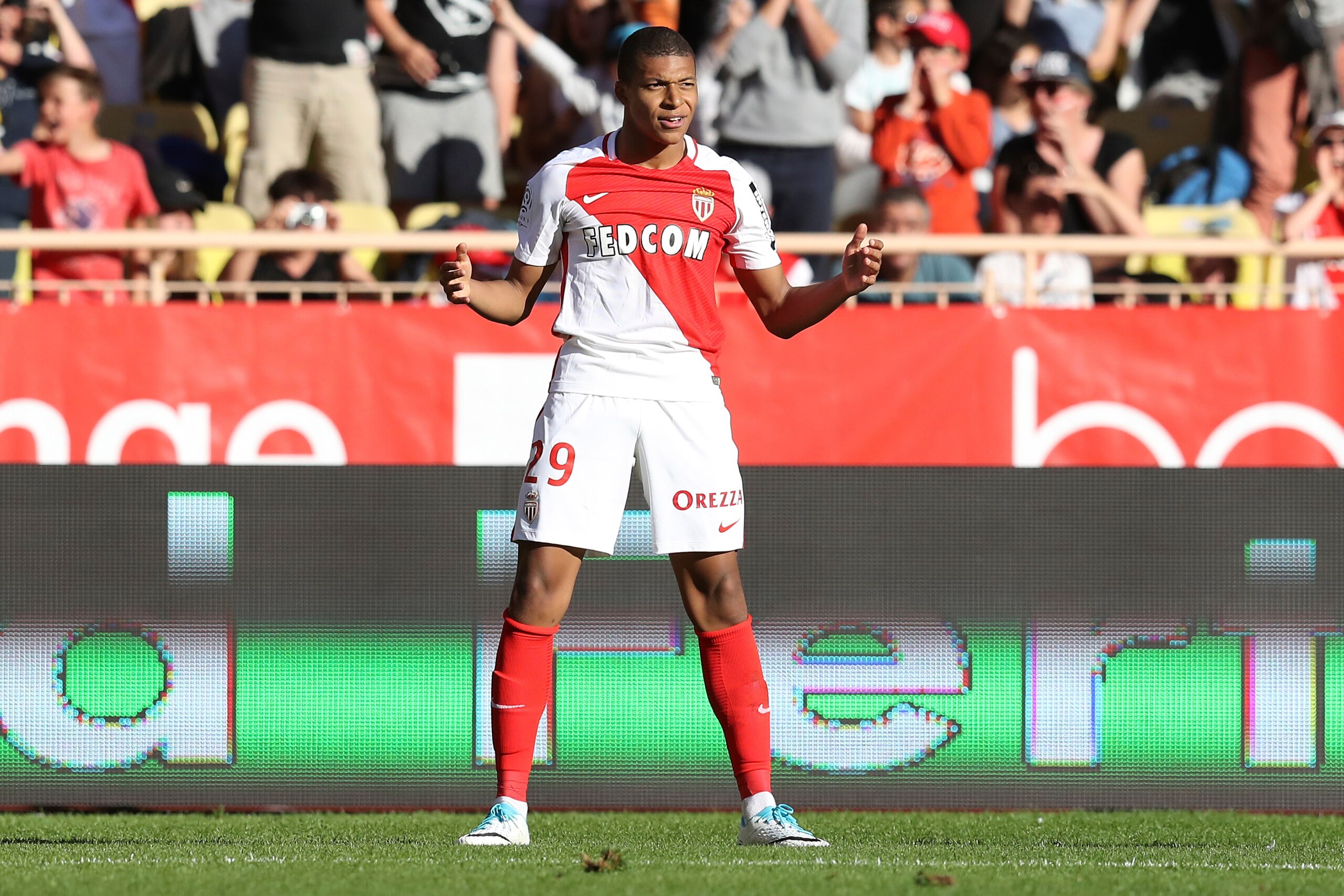 Monaco's French forward Kylian Mbappe Lottin celebrates after scoring a goal during the French L1 football match Monaco (ASM) vs Toulouse (TFC) on April 29, 2017 at the 'Louis II Stadium' in Monaco.   / AFP PHOTO / VALERY HACHE        (Photo credit should
