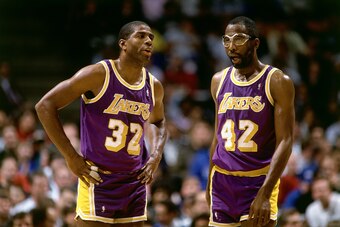 1990: Magic Johnson #32 and James Worthy #42 of the Los Angeles Lakers during an NBA game.  NOTE TO USER: User expressly acknowledges and agrees that, by downloading and/or using this Photograph, user is consenting to the terms and conditions of the Getty
