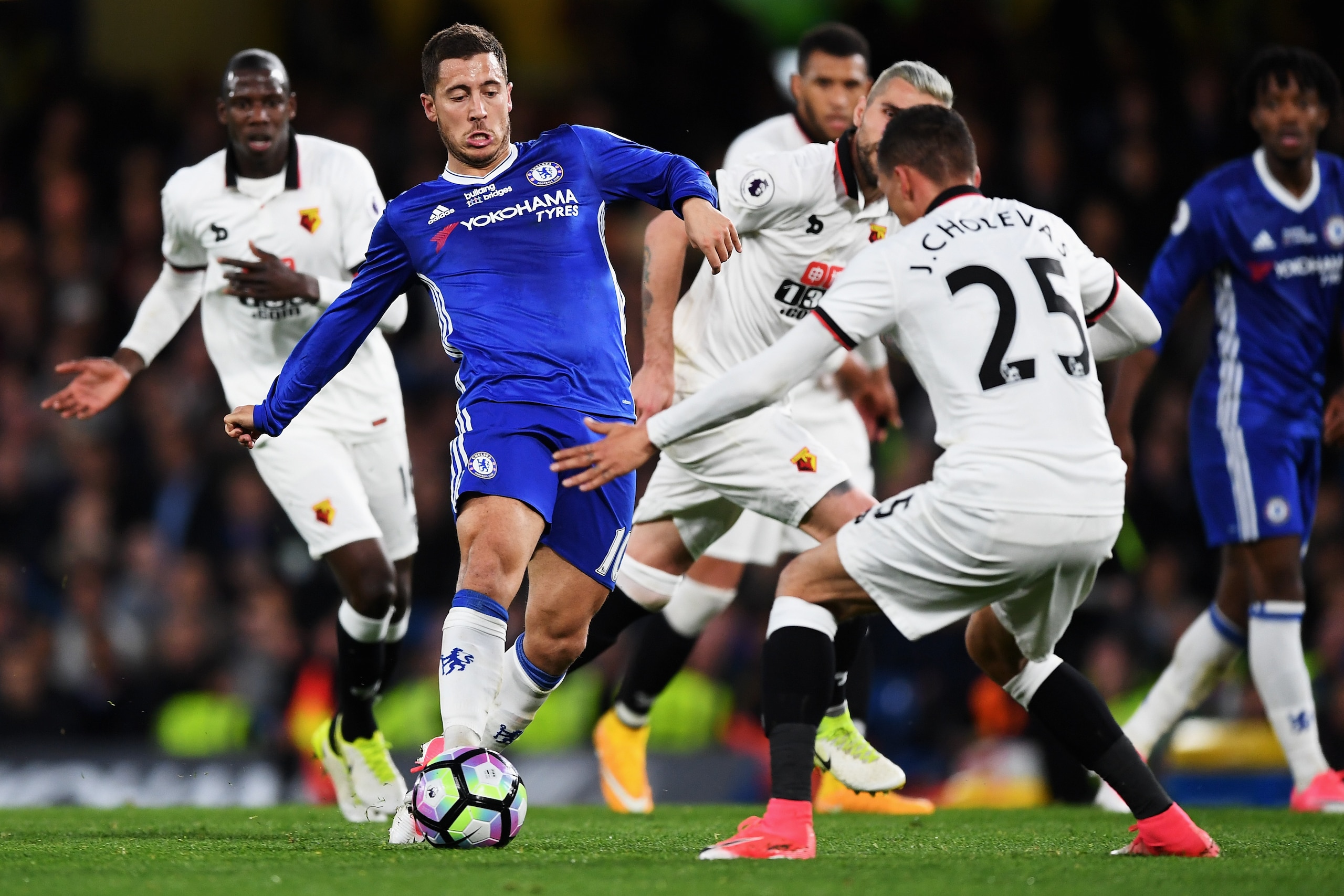 LONDON, ENGLAND - MAY 15: Eden Hazard of Chelsea attempts to get past Jose Holebas of Watford during the Premier League match between Chelsea and Watford at Stamford Bridge on May 15, 2017 in London, England.  (Photo by Shaun Botterill/Getty Images)