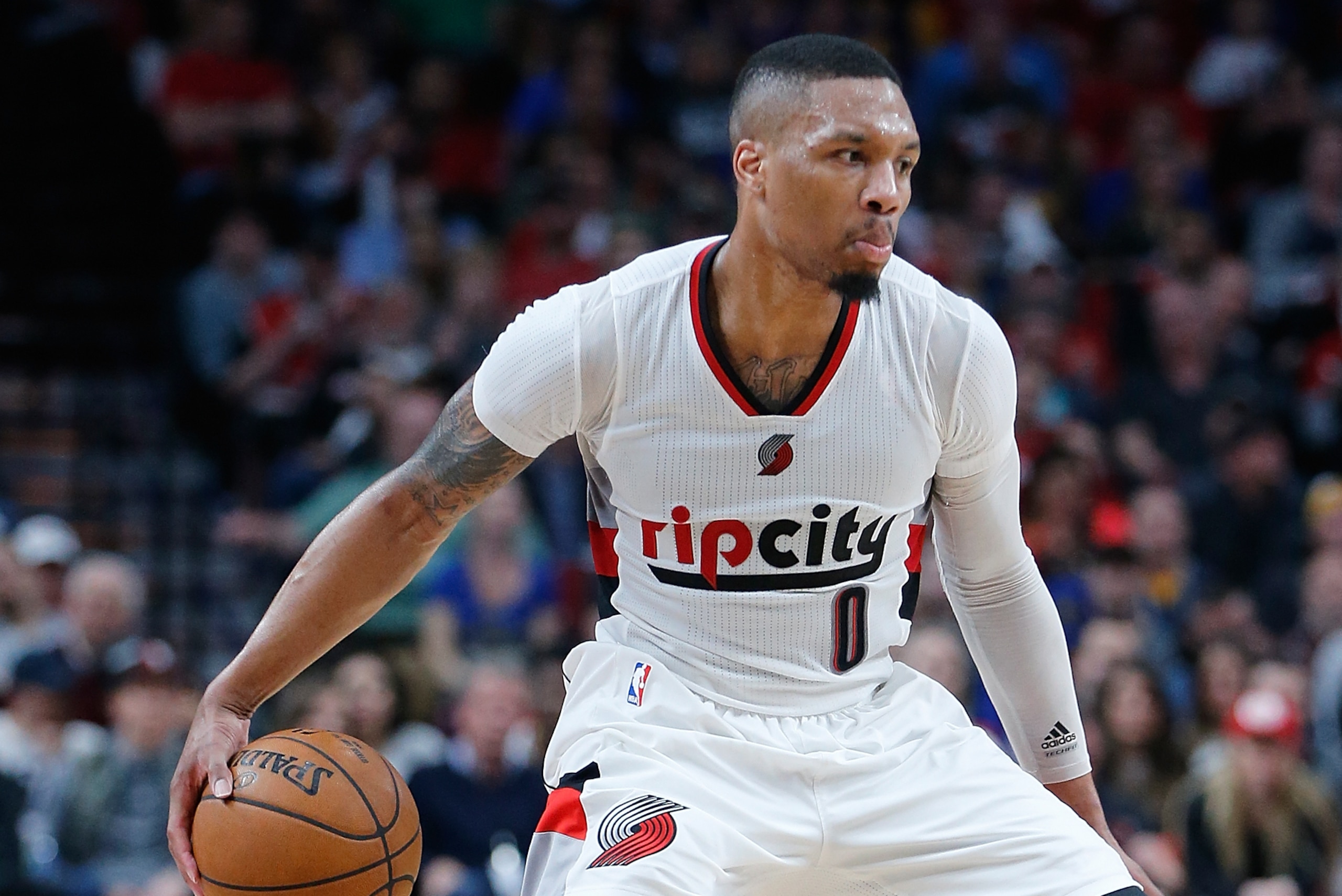 PORTLAND, OR - APRIL 24:  Damian Lillard #0 of the Portland Trail Blazers dribbles the balll against the Golden State Warriors during Game Four of the Western Conference Quarterfinals of  the 2017 NBA Playoffs at Moda Center on April 24, 2017 in Portland,