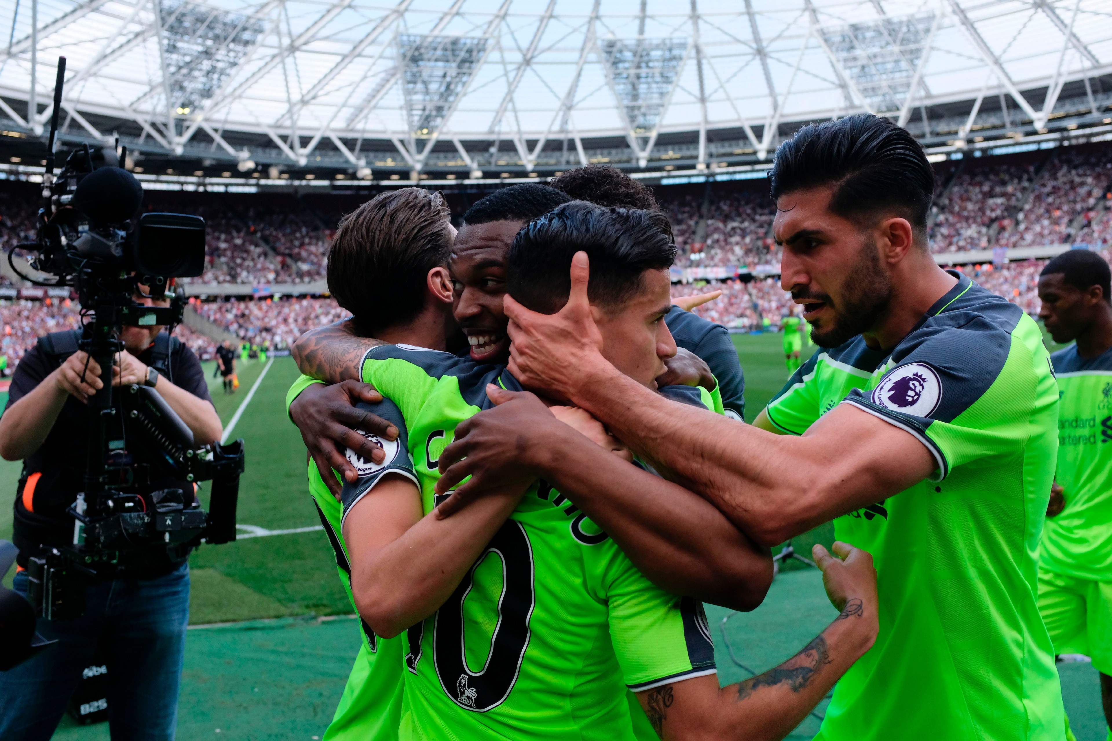 Liverpool's Brazilian midfielder Philippe Coutinho (C) celebrates with teammates Liverpool's German midfielder Emre Can (R) and Liverpool's English striker Daniel Sturridge (2L) after he scored their second goal during the English Premier League football Liverpool's Brazilian midfielder Philippe Coutinho (C) celebrates with teammates Liverpool's German midfielder Emre Can (R) and Liverpool's English striker Daniel Sturridge (2L) after he scored their second goal during the English Premier League football