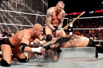 Evolution attacks Roman Reigns at Payback 2014.