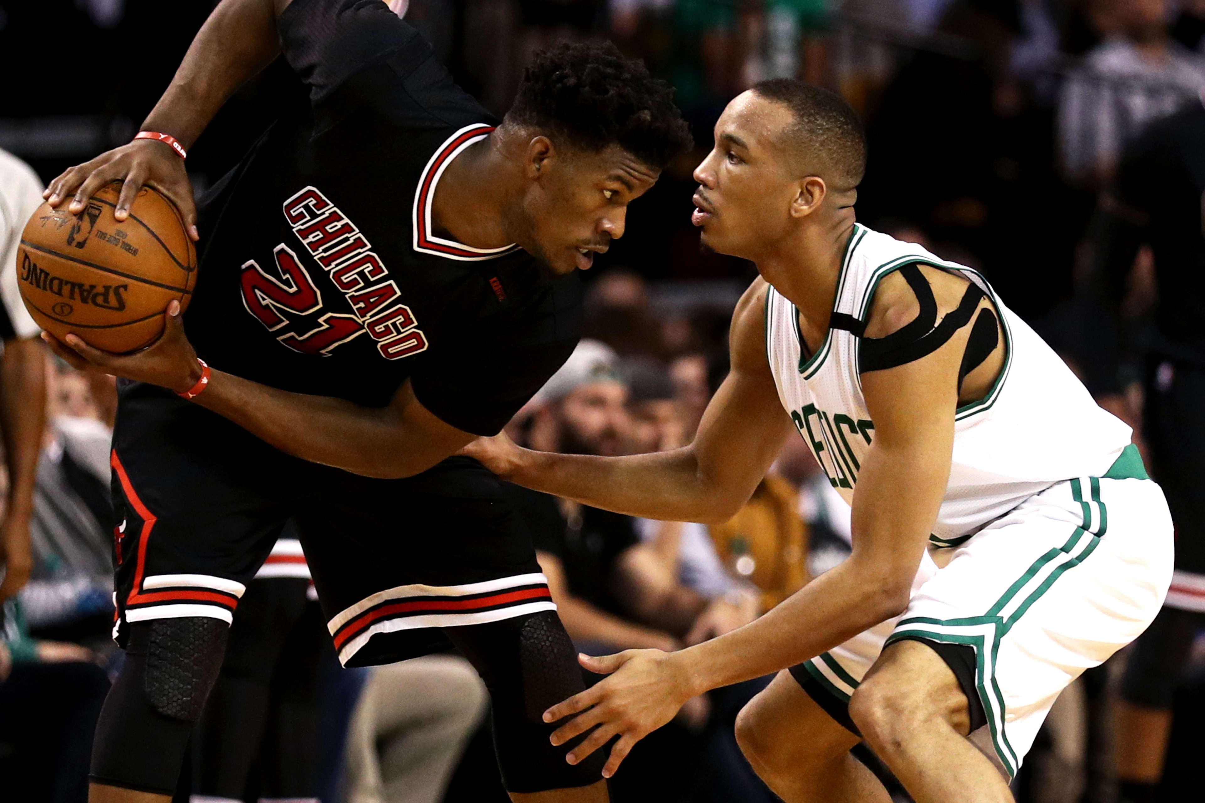 BOSTON, MA - APRIL 26: Avery Bradley #0 of the Boston Celtics defends Jimmy Butler #21 of the Chicago Bulls during the third quarter of Game Five of the Eastern Conference Quarterfinals at TD Garden on April 26, 2017 in Boston, Massachusetts. NOTE TO USER