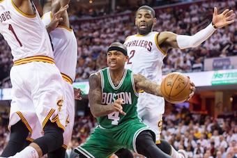 CLEVELAND, OH - APRIL 19: James Jones #1, Tristan Thompson #13 and Kyrie Irving #2 of the Cleveland Cavaliers try to stop Isaiah Thomas #4 of the Boston Celtics in the second half during Game One in the Eastern Conference Quarterfinals of the 2015 NBA Pla