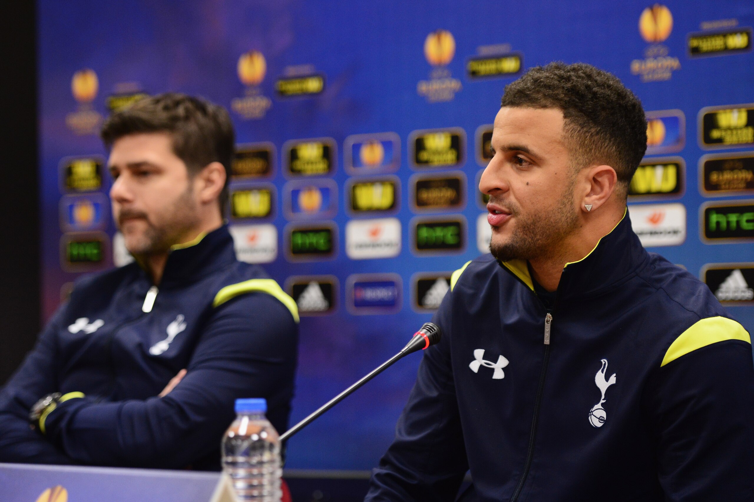 ISTANBUL, TURKEY - DECEMBER 10:  Kyle Walker speaks as Mauricio Pochettino manager of Spurs looks on during a Tottenham Hotspur press conference, ahead of the UEFA Europa League Group C match, against Beskitas JK at Ataturk Olympic Stadium on December 10,