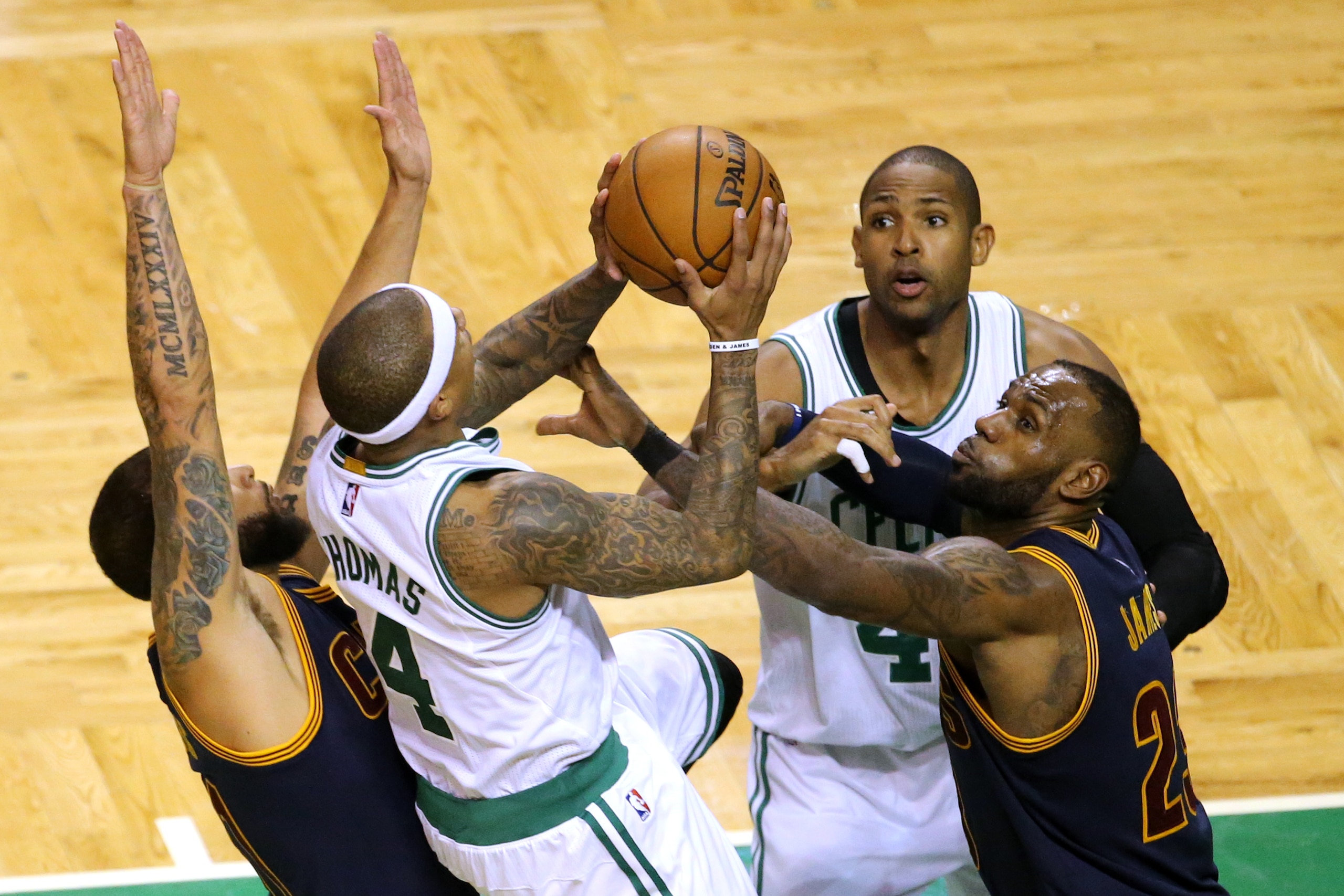 BOSTON, MA - MARCH 1: Isaiah Thomas #4 of the Boston Celtics takes a shot against Deron Williams #31 of the Cleveland Cavaliers and LeBron James #23 during the fourth quarter at TD Garden on March 1, 2017 in Boston, Massachusetts. The Celtics defeat the C BOSTON, MA - MARCH 1: Isaiah Thomas #4 of the Boston Celtics takes a shot against Deron Williams #31 of the Cleveland Cavaliers and LeBron James #23 during the fourth quarter at TD Garden on March 1, 2017 in Boston, Massachusetts. The Celtics defeat the C